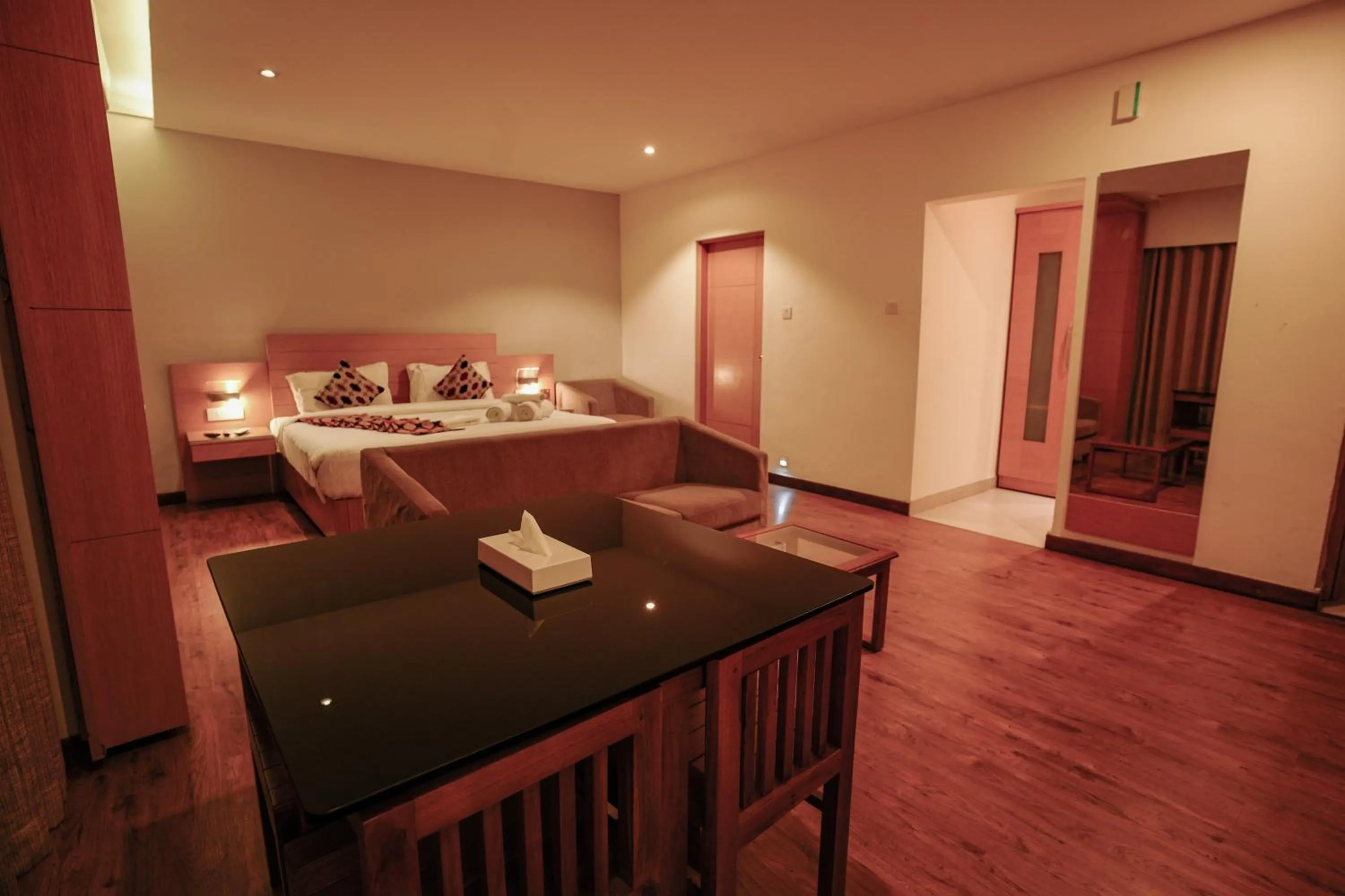 Bed in Hotel Indriya Wayanad