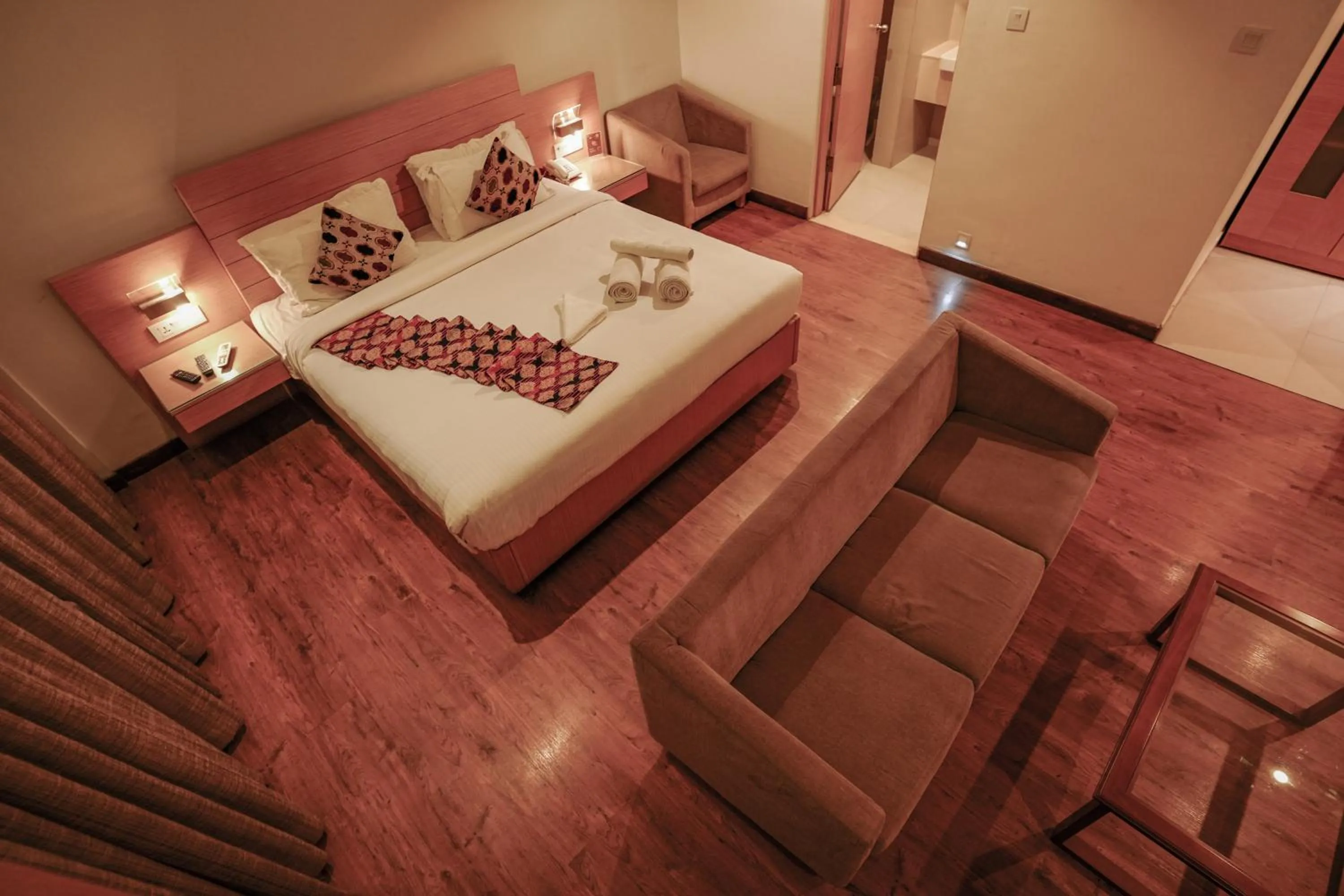 Bed in Hotel Indriya Wayanad