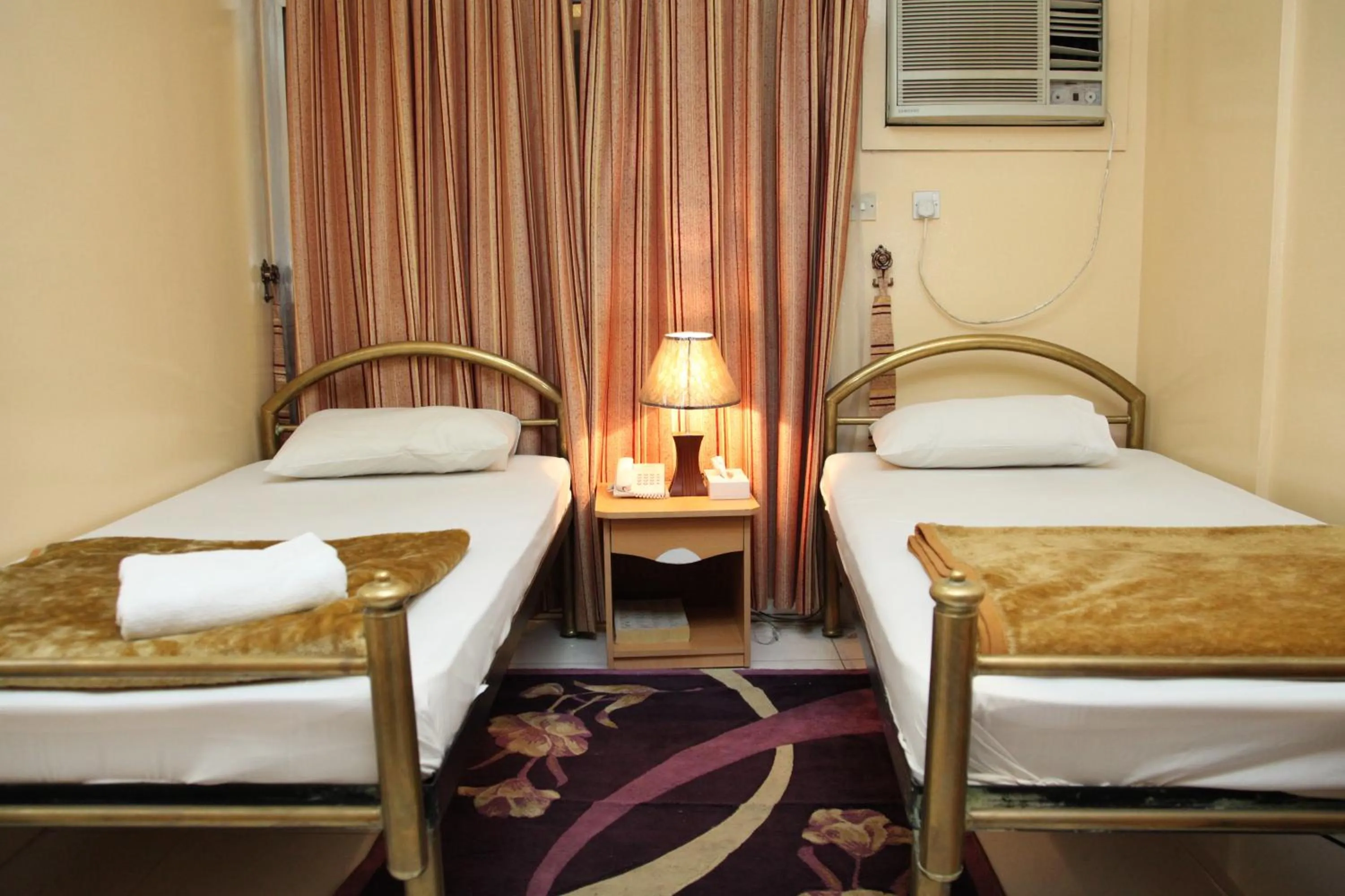 Bed in Zaineast Hotel