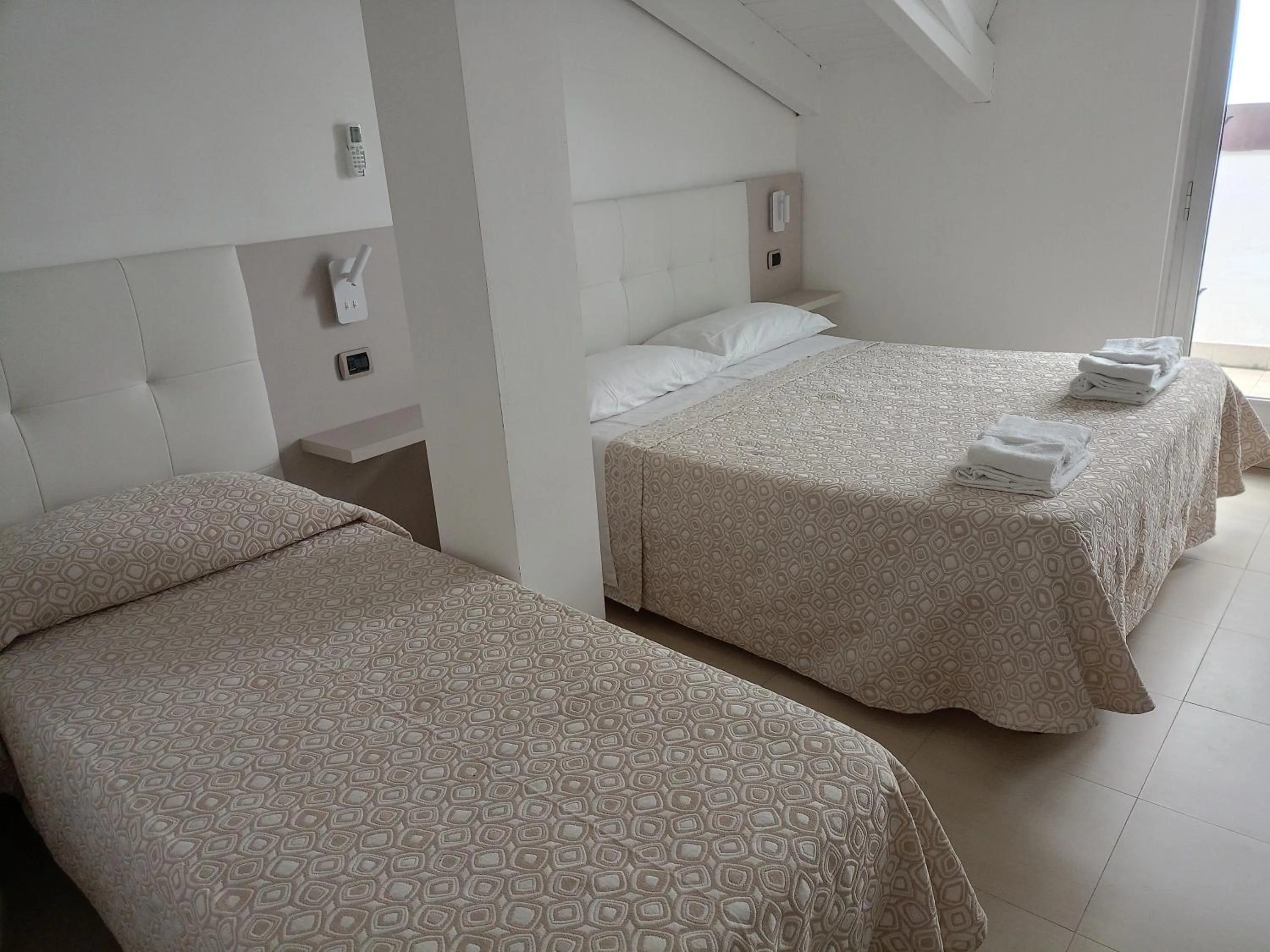 Bed in Hotel Riviera