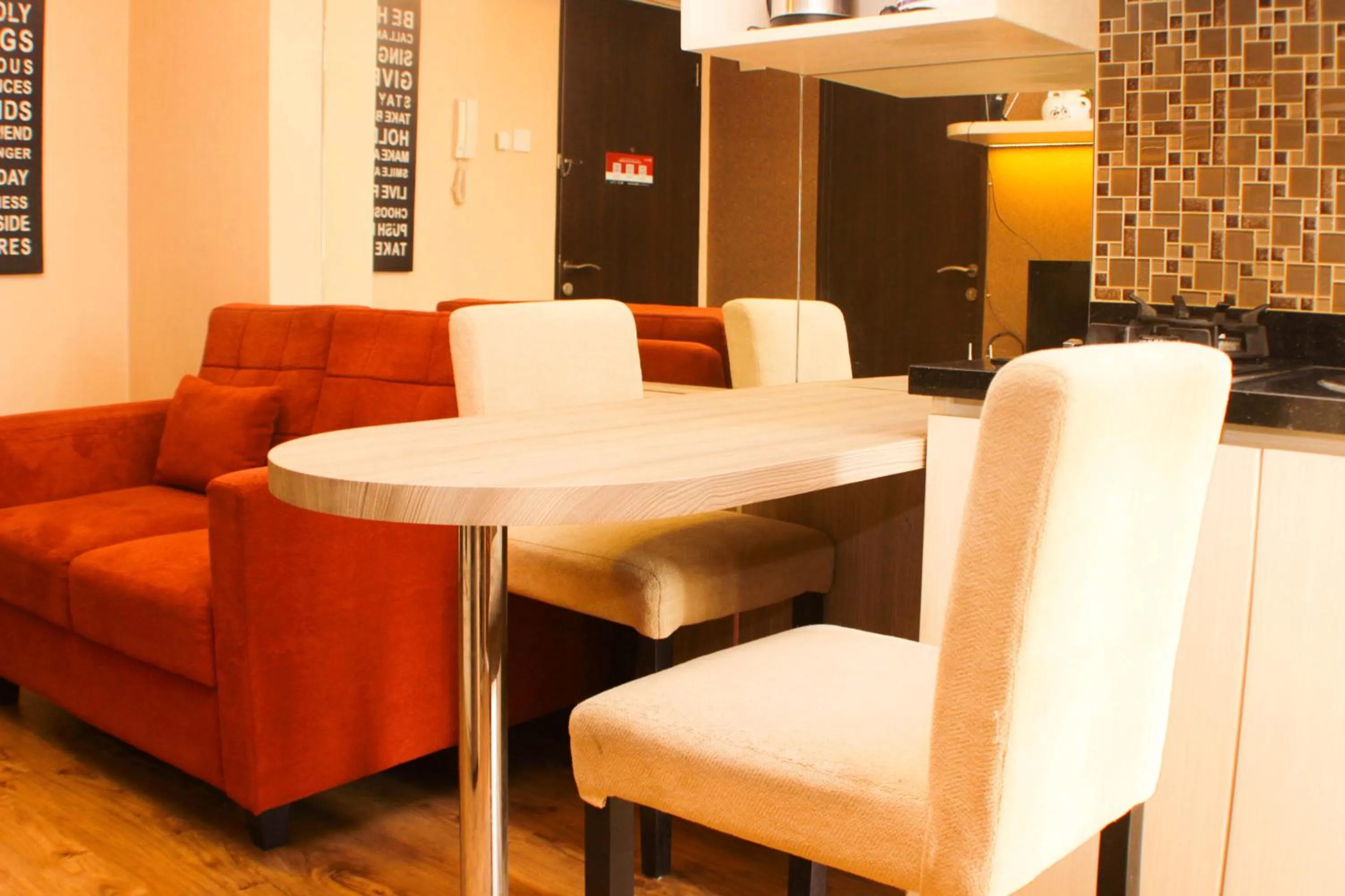 Dining area in Strategic and Simply 2BR at Bassura City Apartment By Travelio