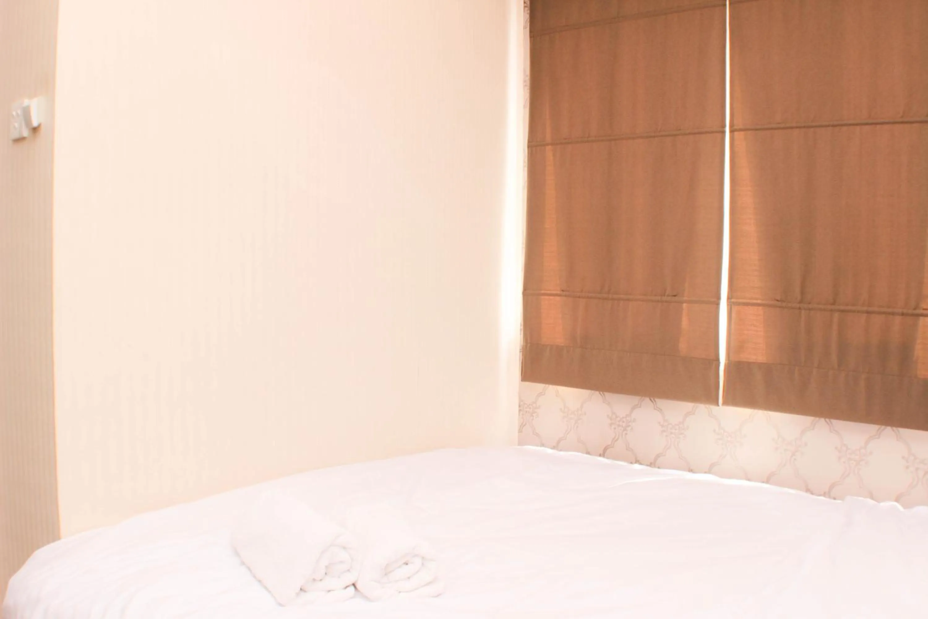 Bed in Strategic and Simply 2BR at Bassura City Apartment By Travelio