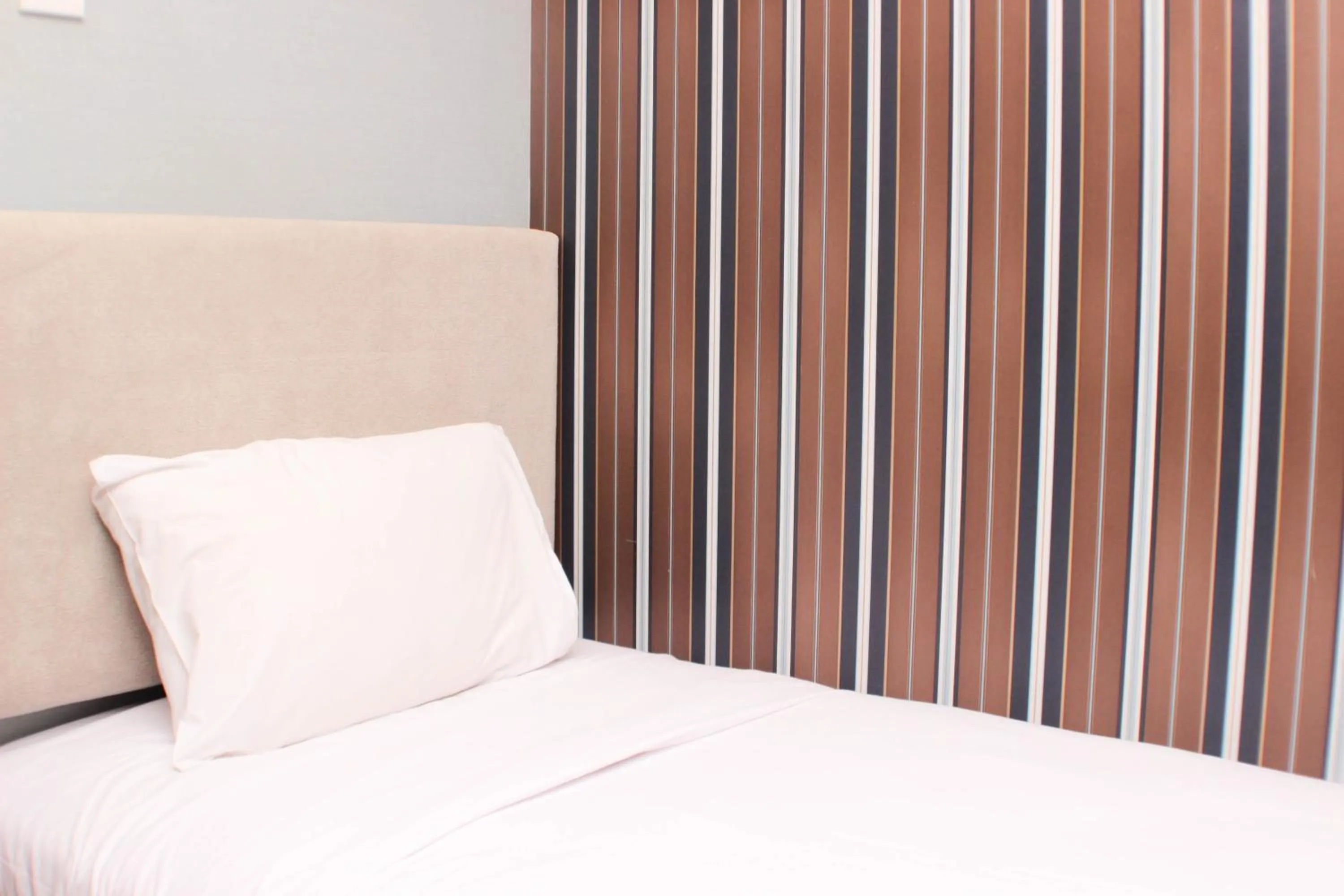 Bed in Strategic and Simply 2BR at Bassura City Apartment By Travelio