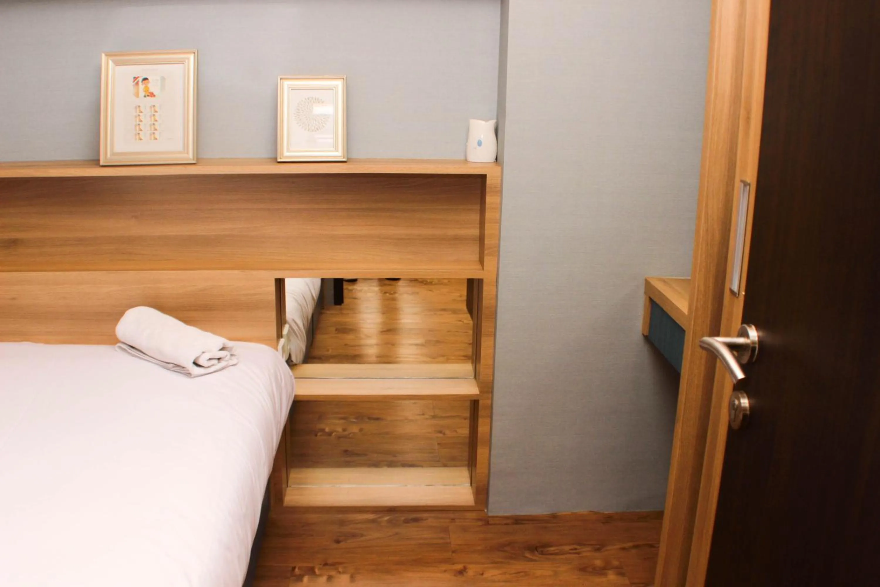 Bed in Strategic and Simply 2BR at Bassura City Apartment By Travelio