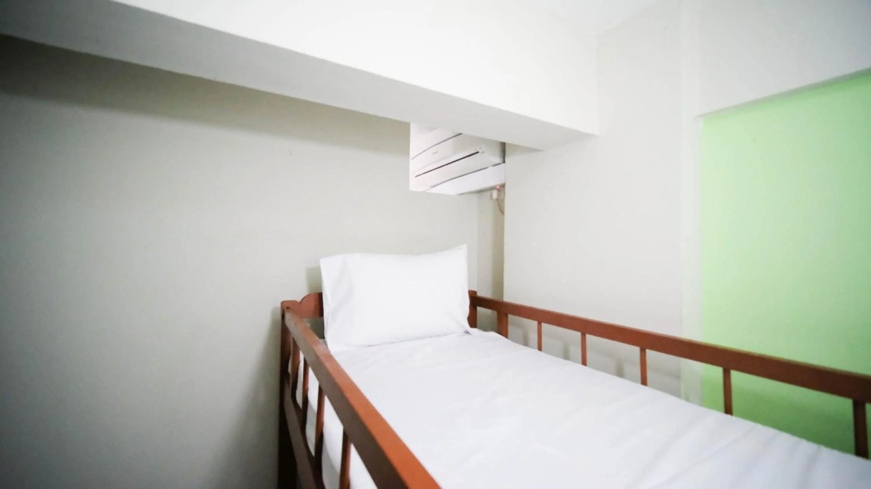 Bed in Homey and Comfy 2BR at Dian Regency Apartment By Travelio