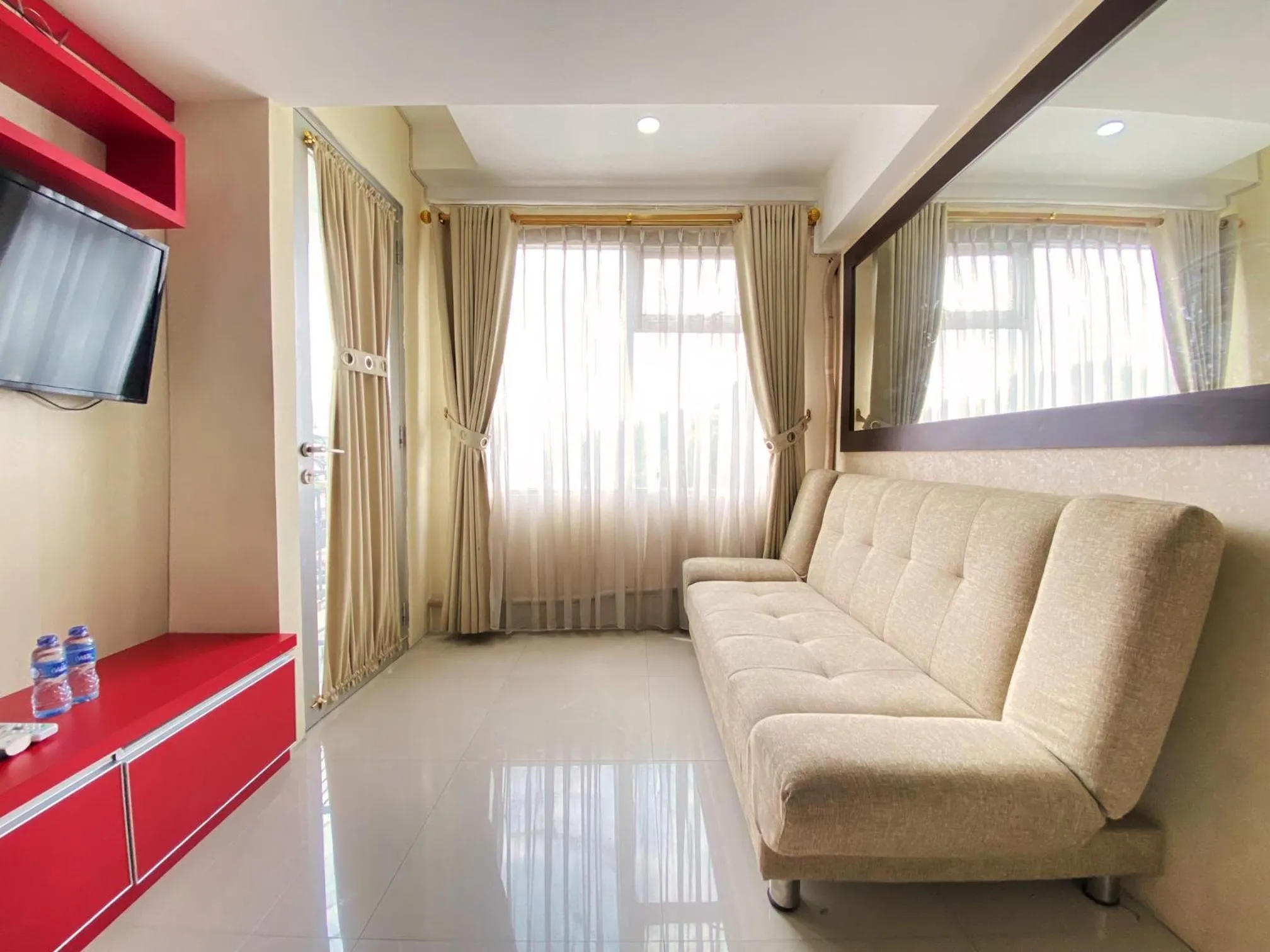 Living room in Spacious 2BR at Jarrdin Cihampelas Apartment By Travelio