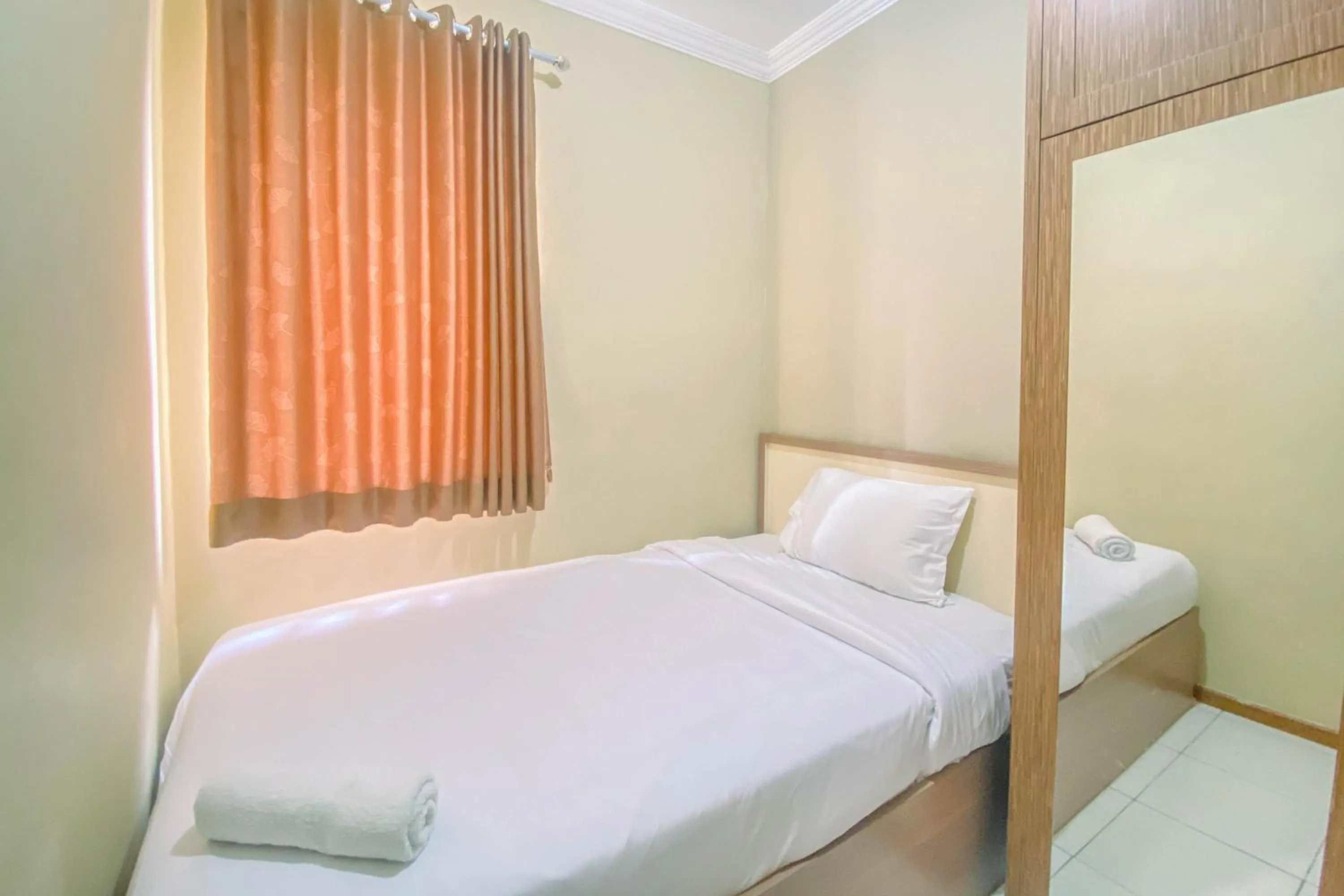 Bed in Relaxing 2BR at Grand Palace Kemayoran Apartment By Travelio
