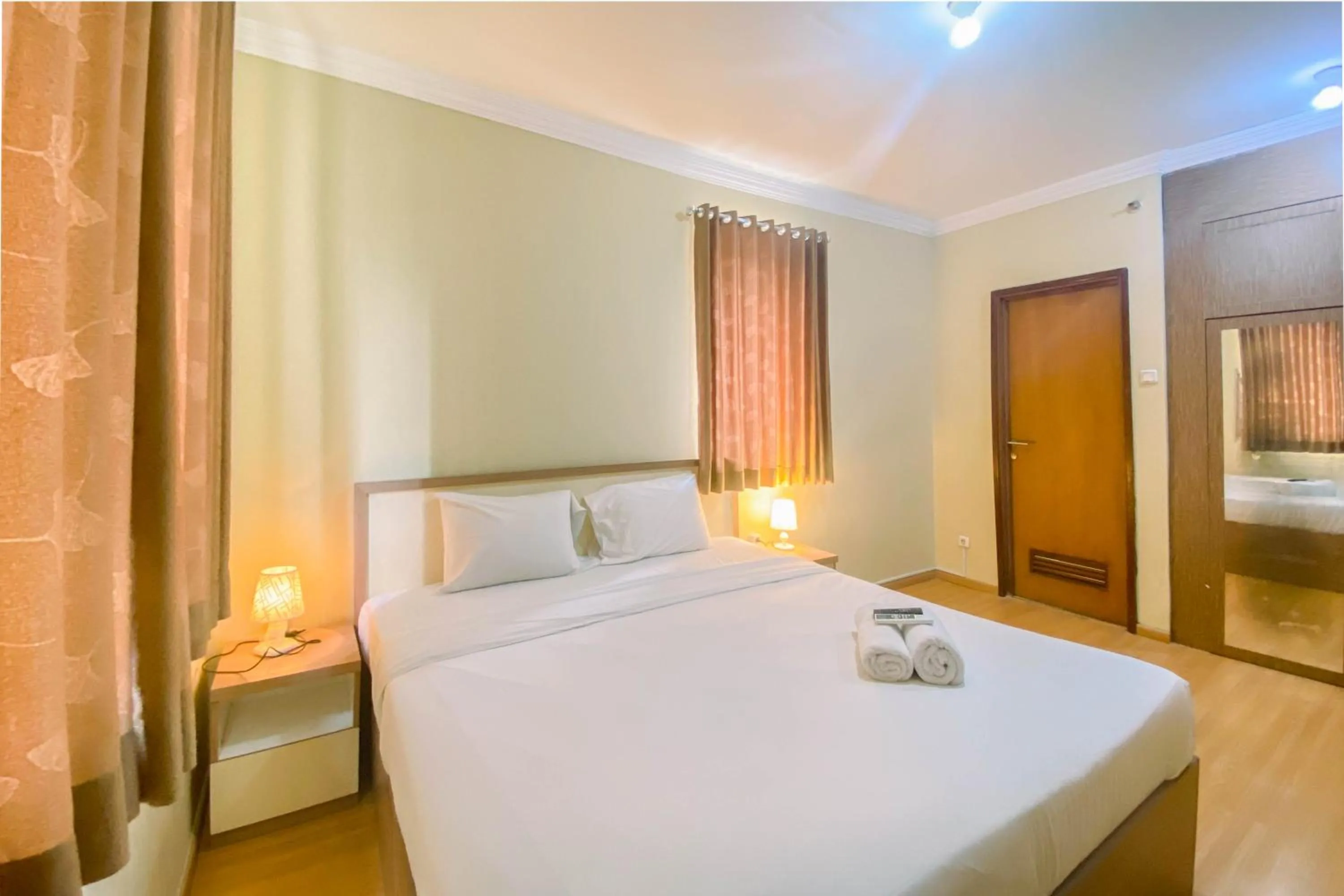 Bed in Relaxing 2BR at Grand Palace Kemayoran Apartment By Travelio