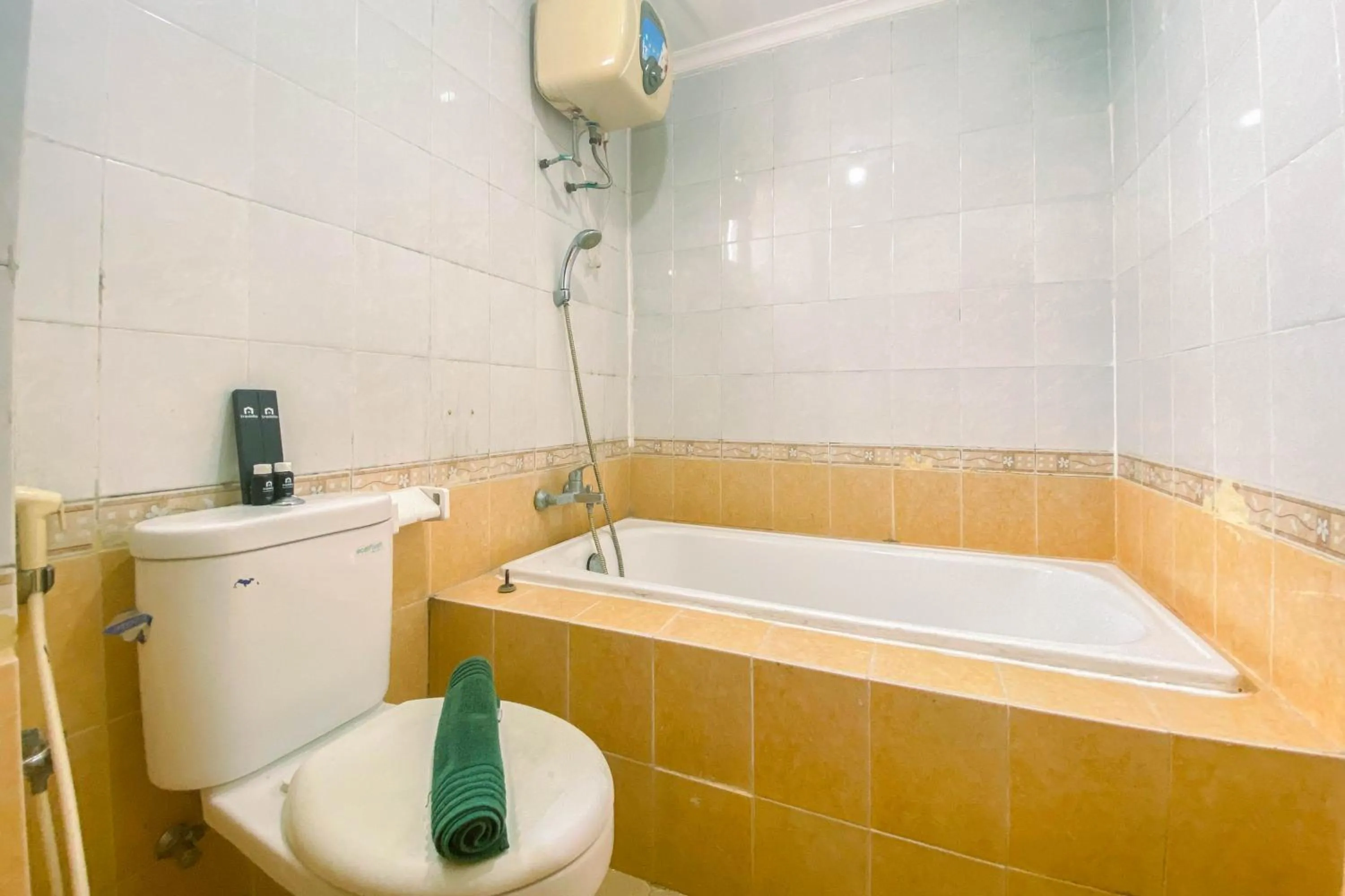 Bathroom in Relaxing 2BR at Grand Palace Kemayoran Apartment By Travelio