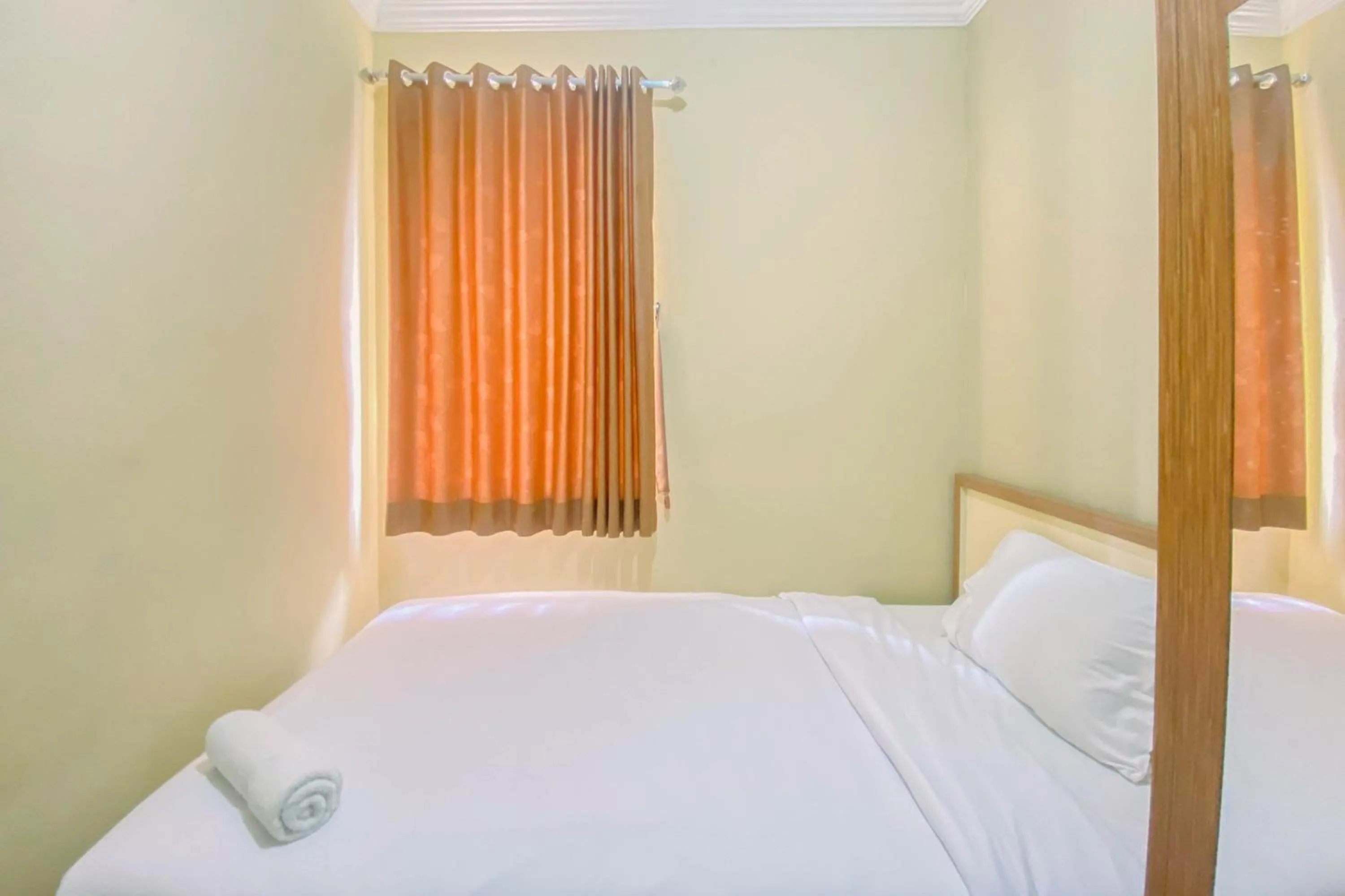 Bed in Relaxing 2BR at Grand Palace Kemayoran Apartment By Travelio