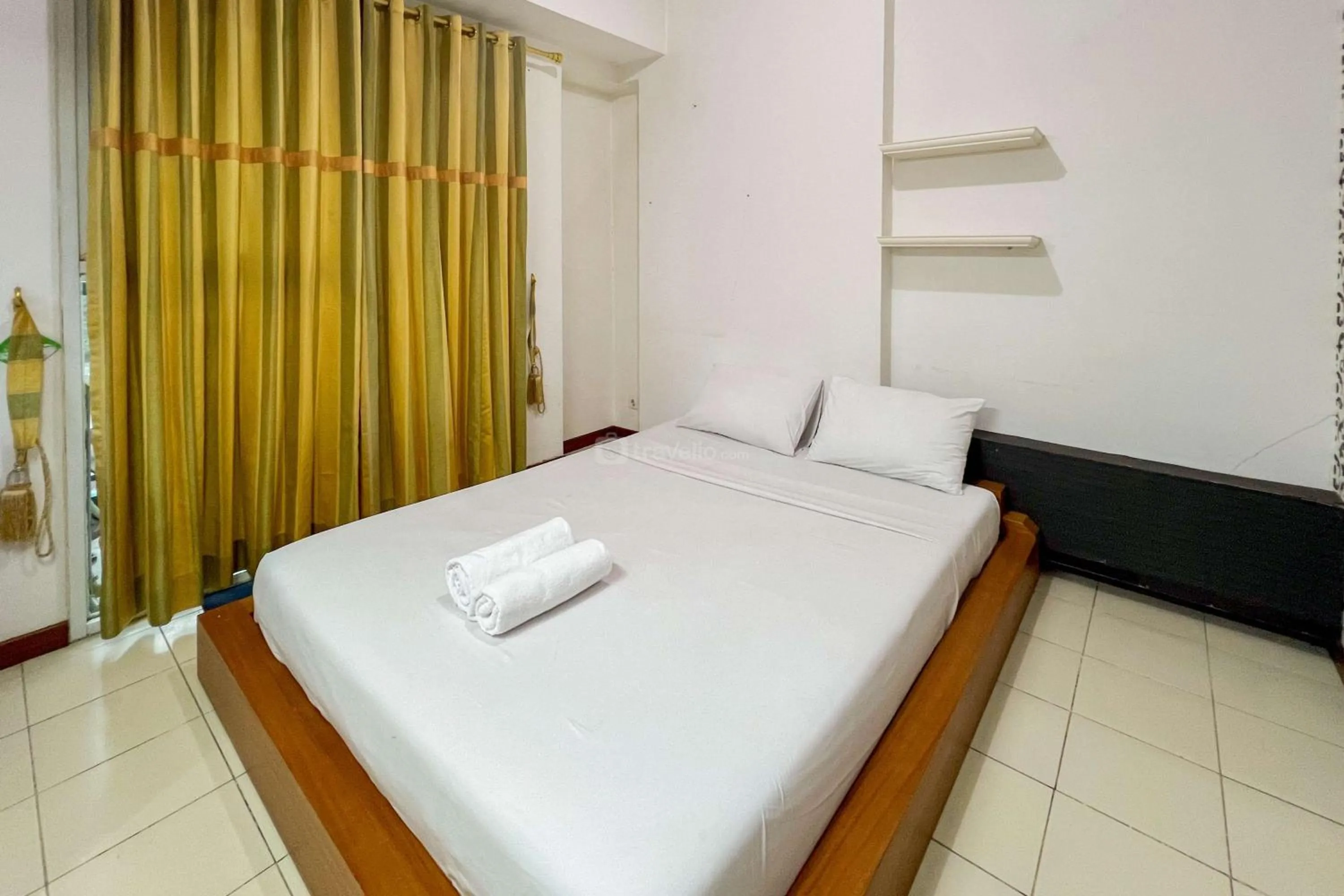 Bed in Cozy 1BR at Marbella Suites Dago Pakar Bandung Apartment By Travelio