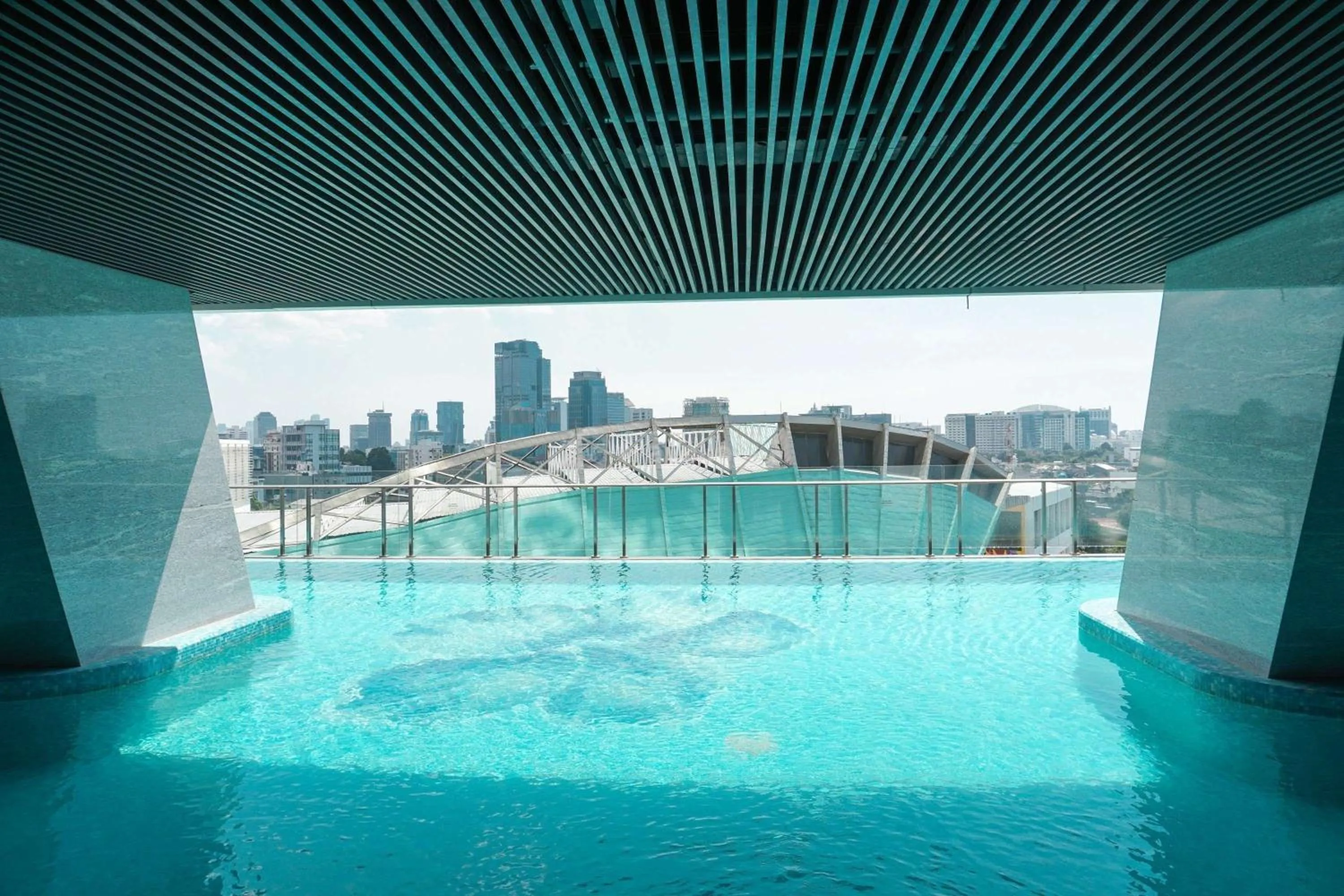 Swimming pool in Good Choice and Elegant Studio Menteng Park Apartment By Travelio