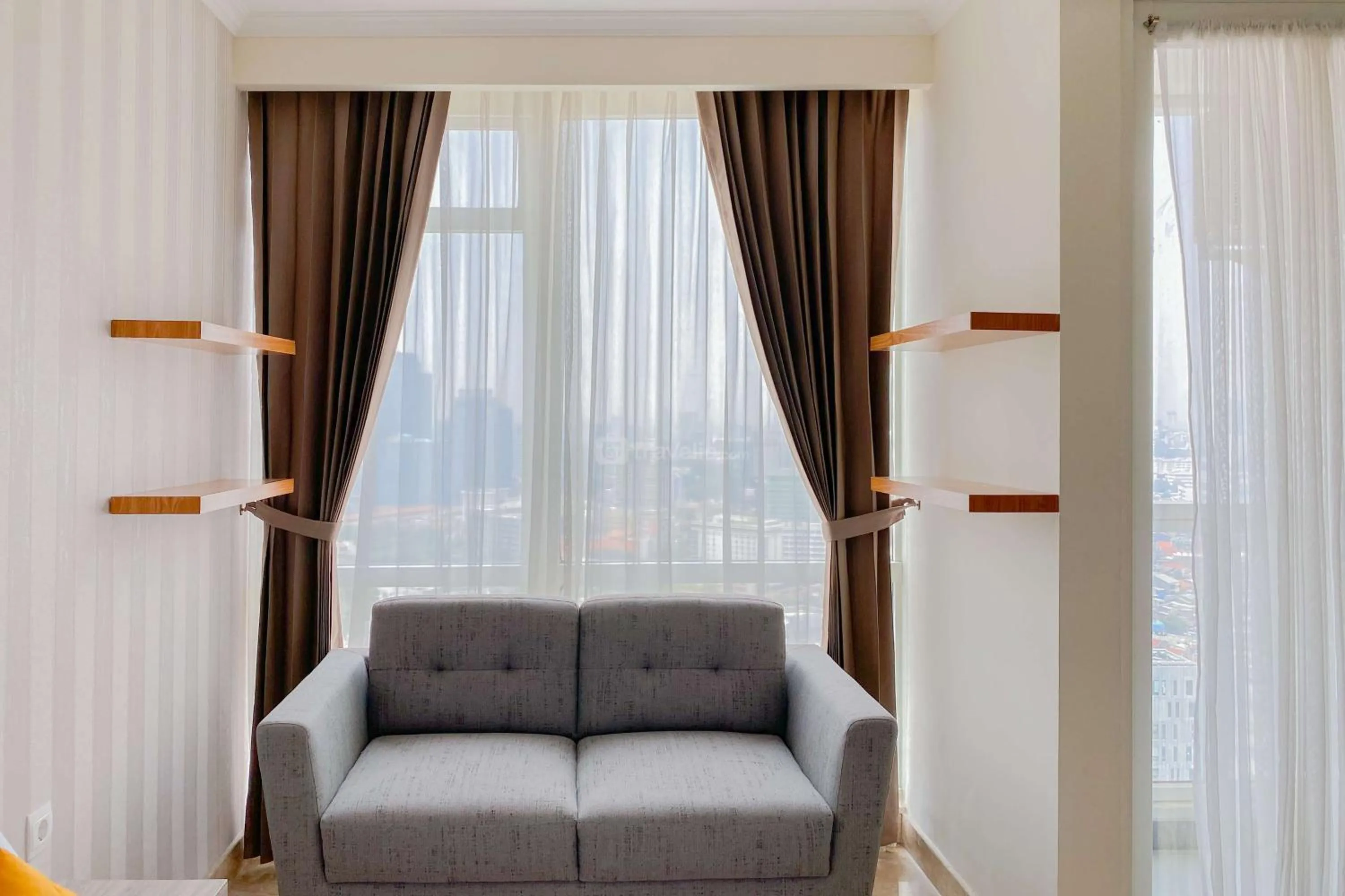 Bed in Good Choice and Elegant Studio Menteng Park Apartment By Travelio