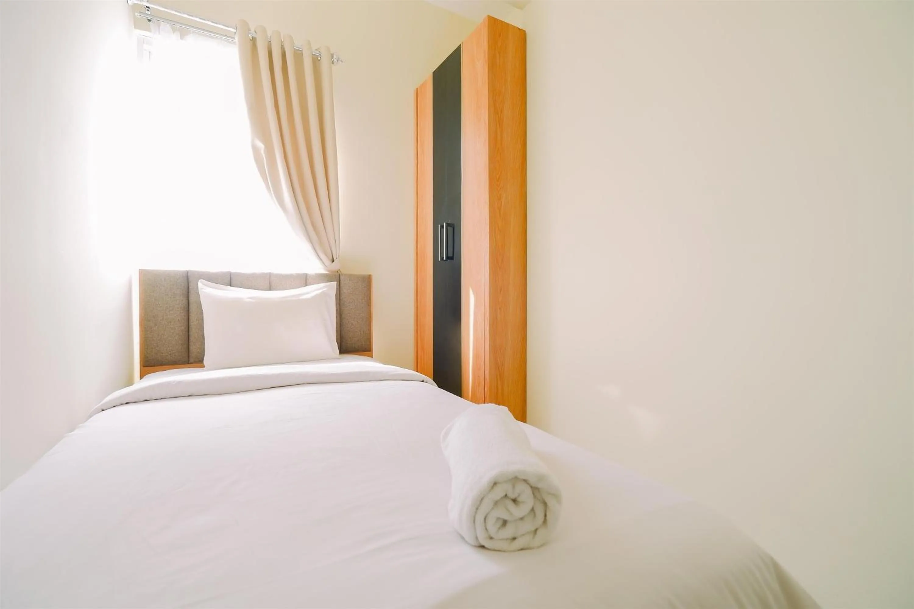 Bed in Warm and Cozy Living 2BR Bogorienze Apartment By Travelio