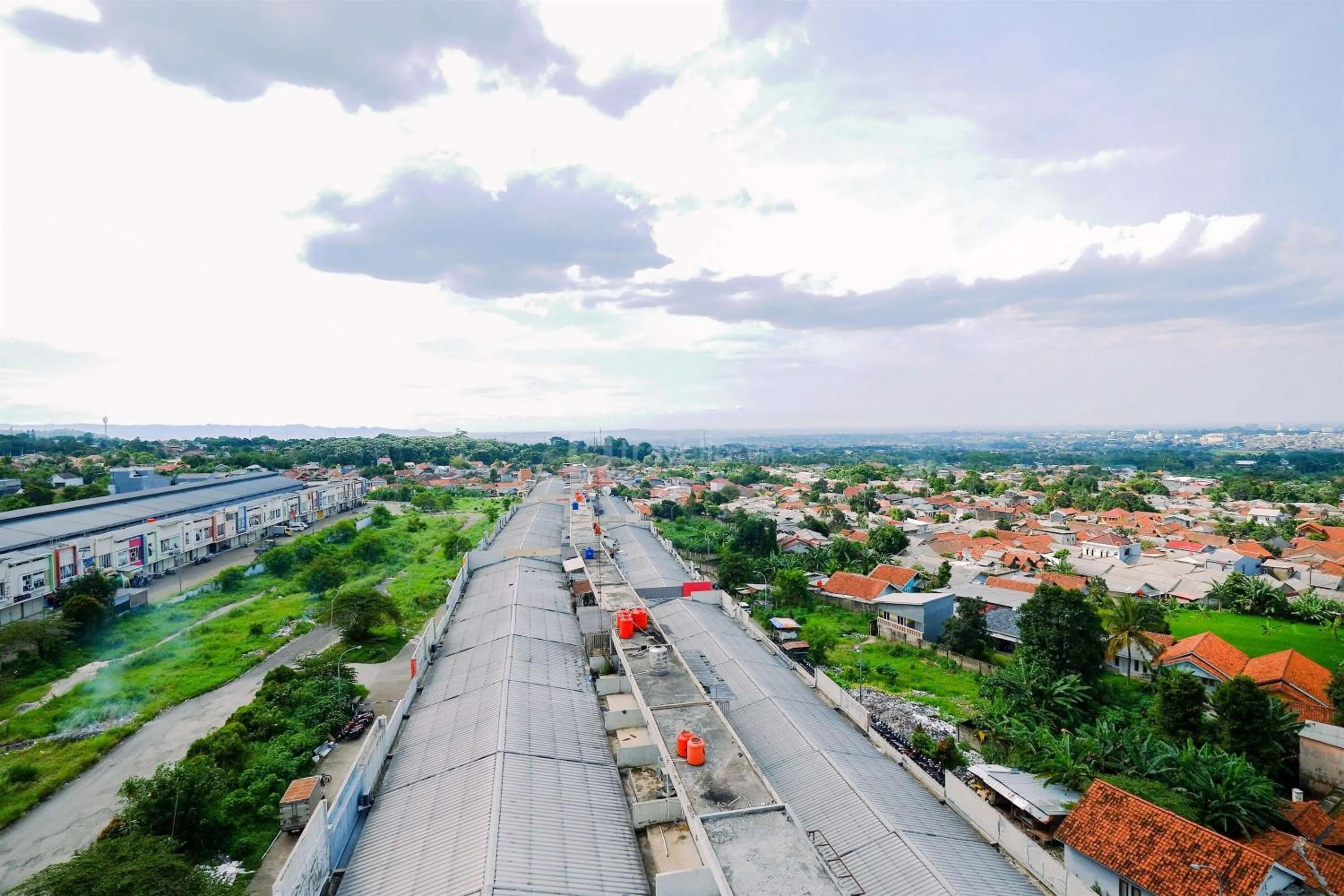 Bed in Warm and Cozy Living 2BR Bogorienze Apartment By Travelio