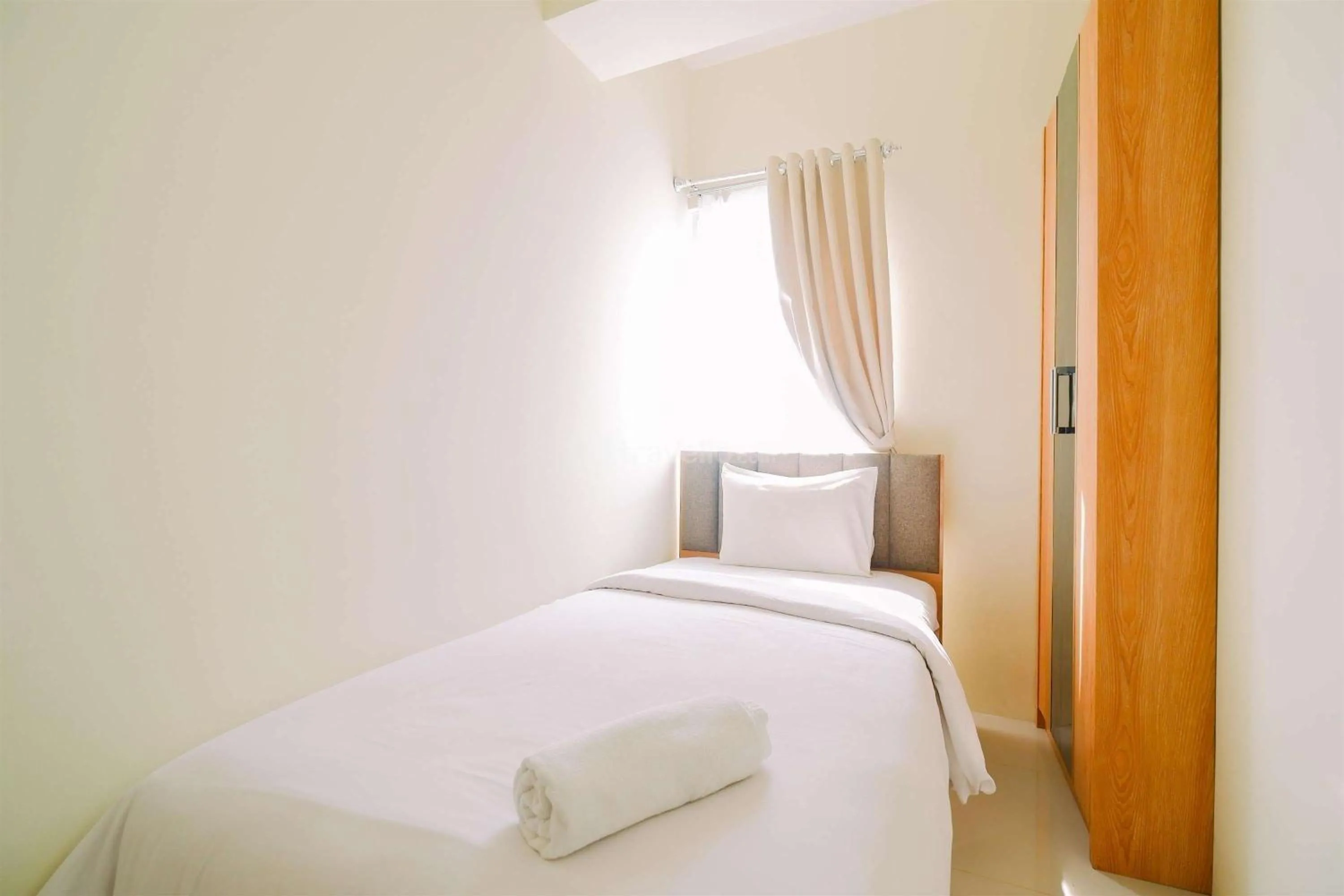 Bedroom, Bed in Warm and Cozy Living 2BR Bogorienze Apartment By Travelio