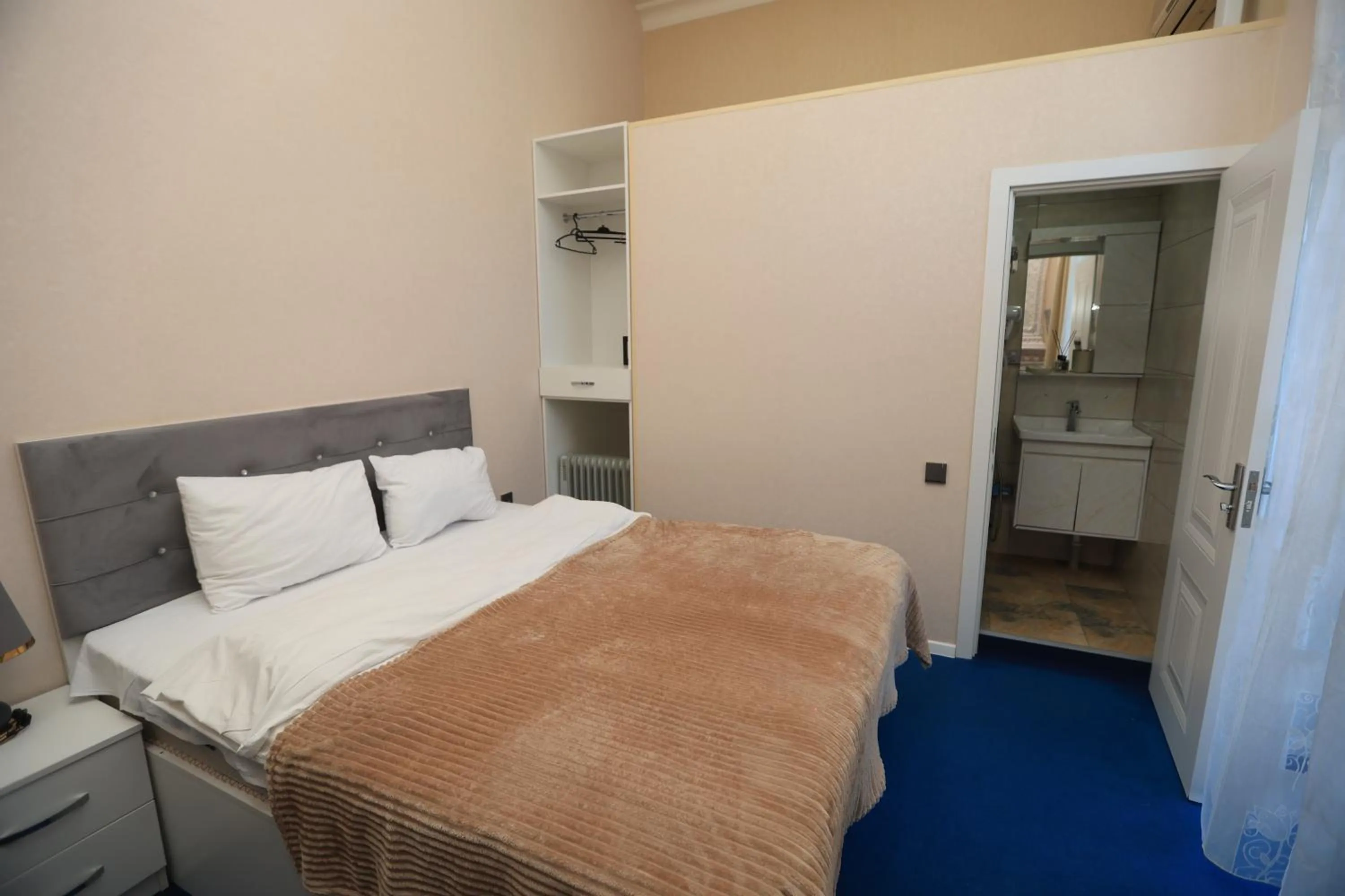 Bed in NH Nizami Hotel