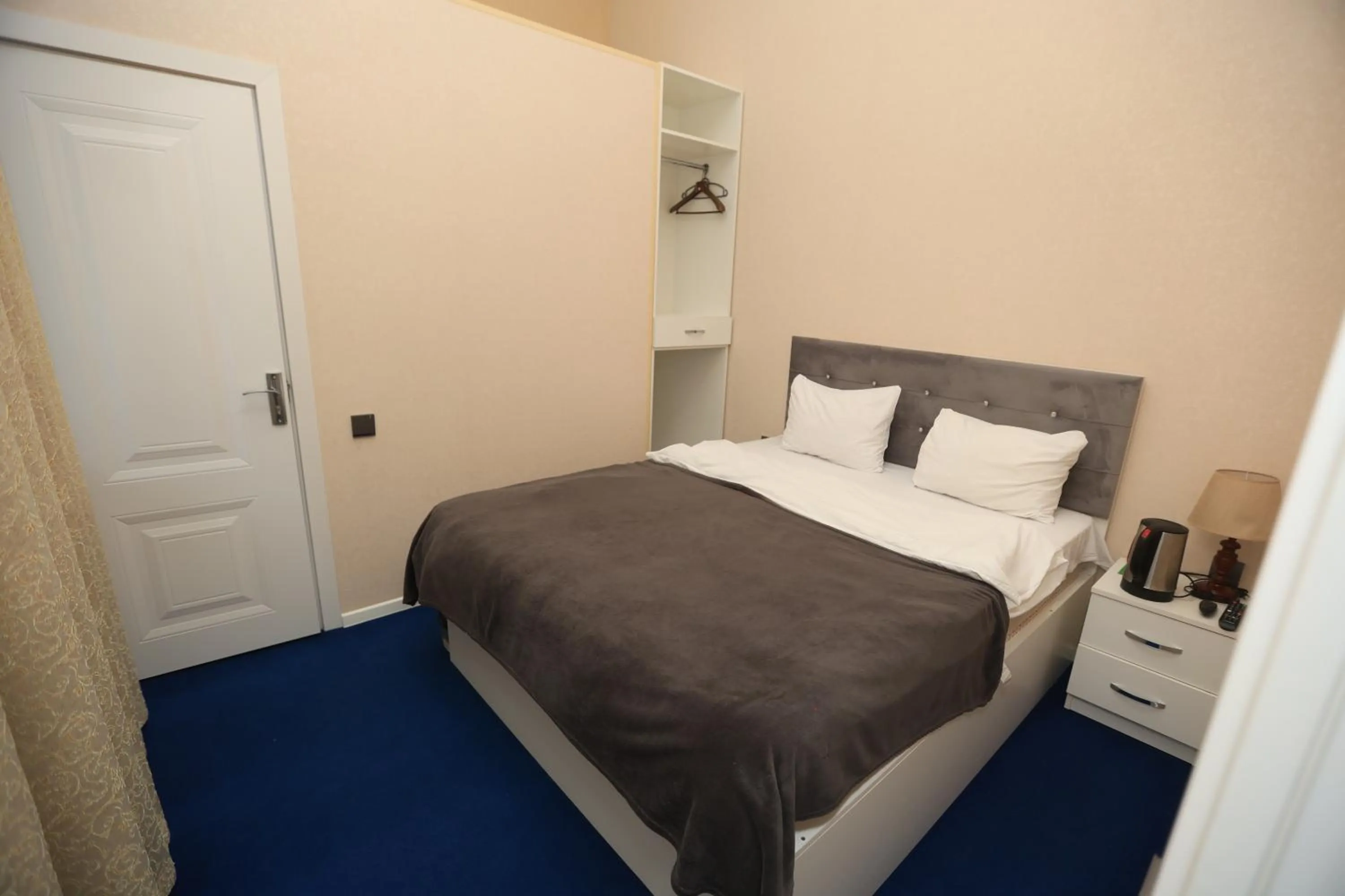 Bed in NH Nizami Hotel