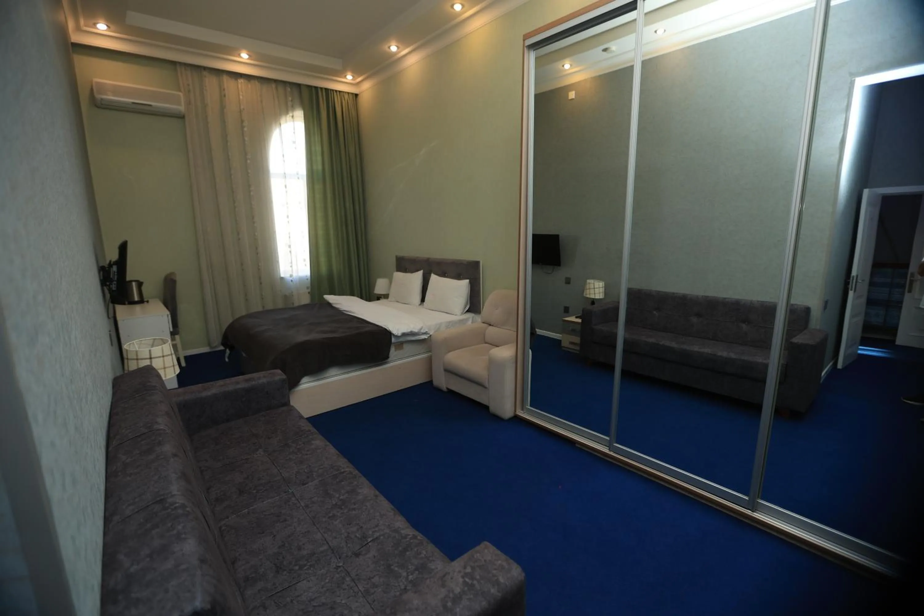 Bed in NH Nizami Hotel