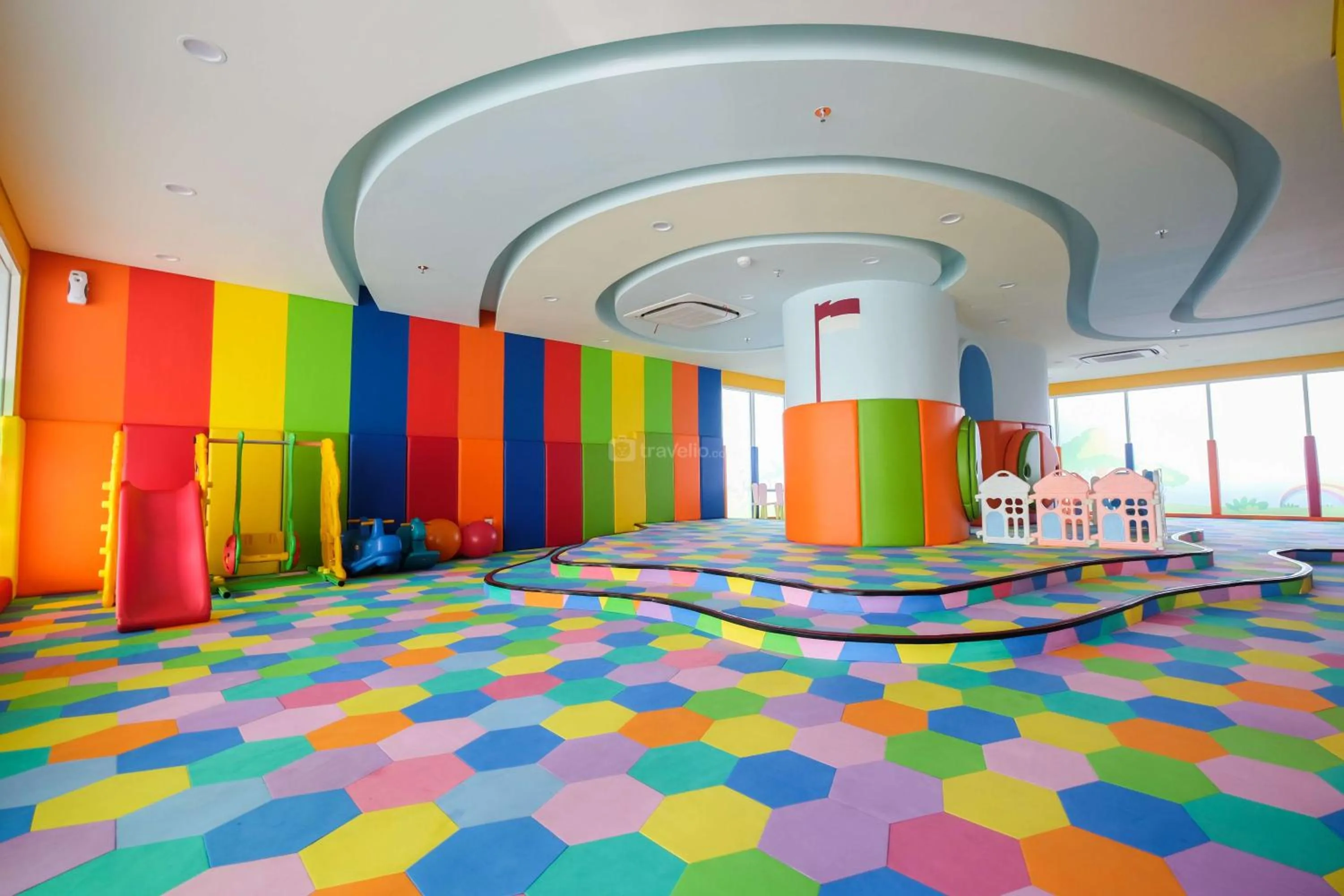 Children play ground in Comfort and Modern Look Studio Menteng Park Apartment By Travelio