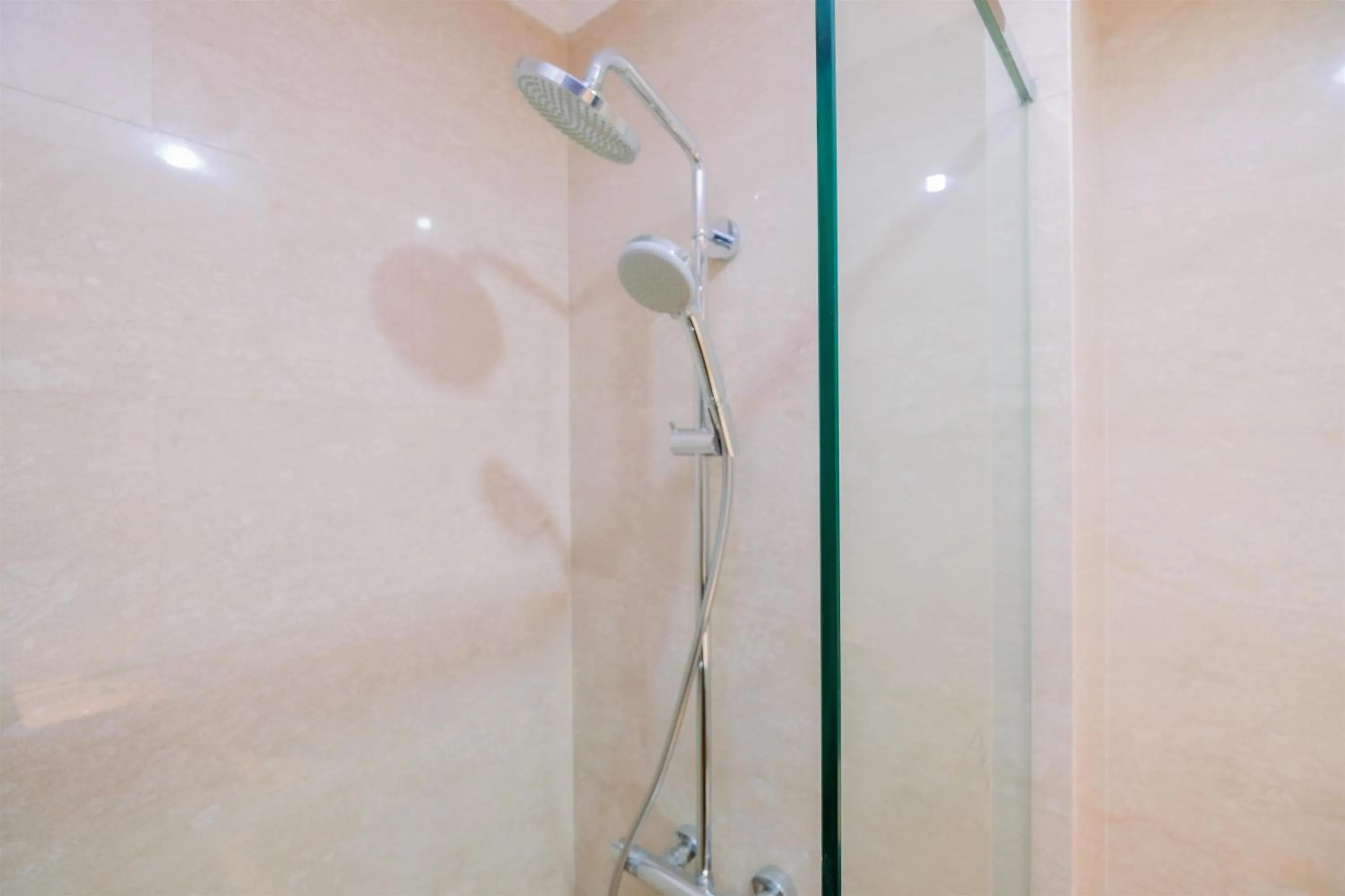 Bathroom in Comfort and Modern Look Studio Menteng Park Apartment By Travelio