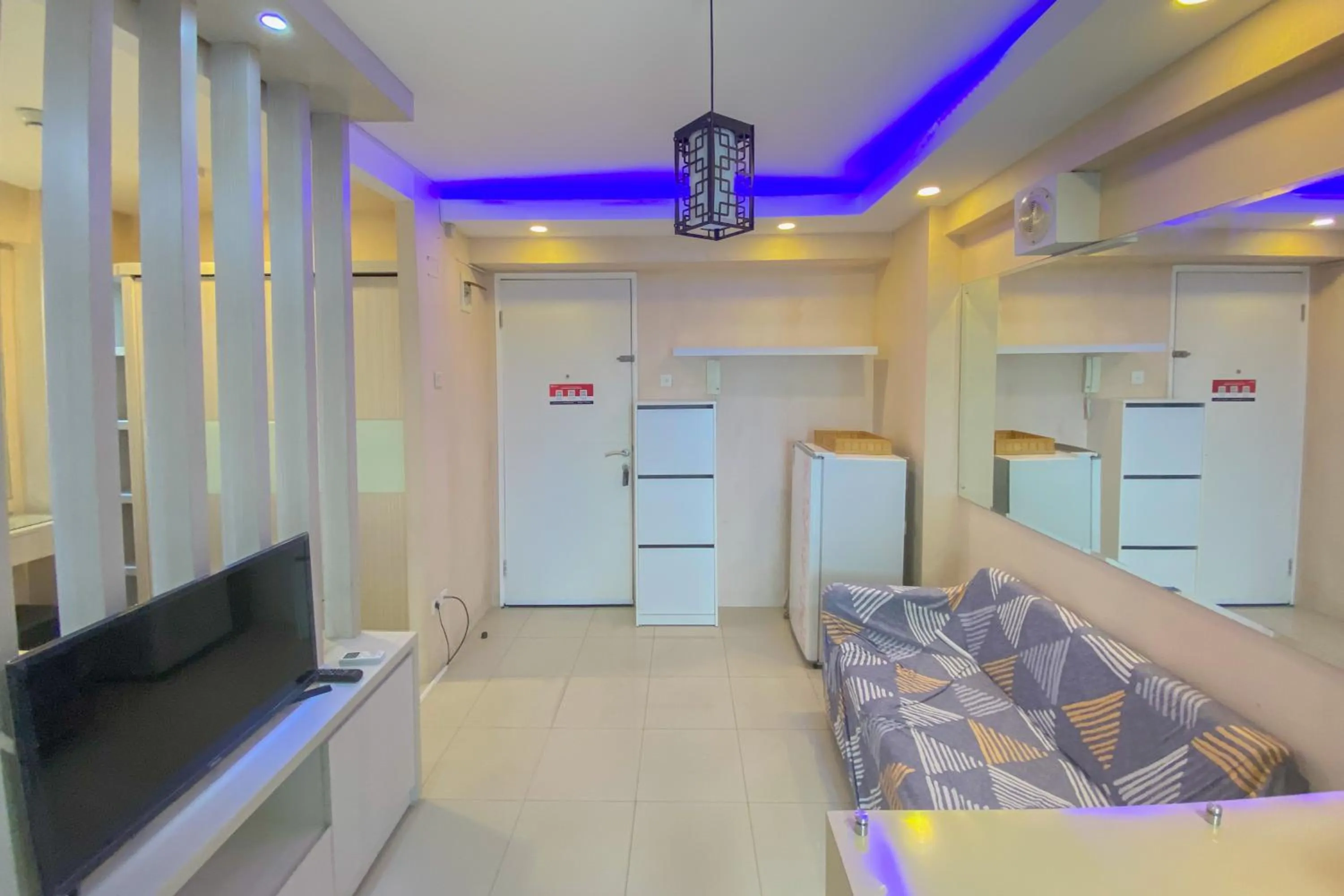 Living room, Bed in Best Deal and Spacious Studio at Bassura City Apartment By Travelio