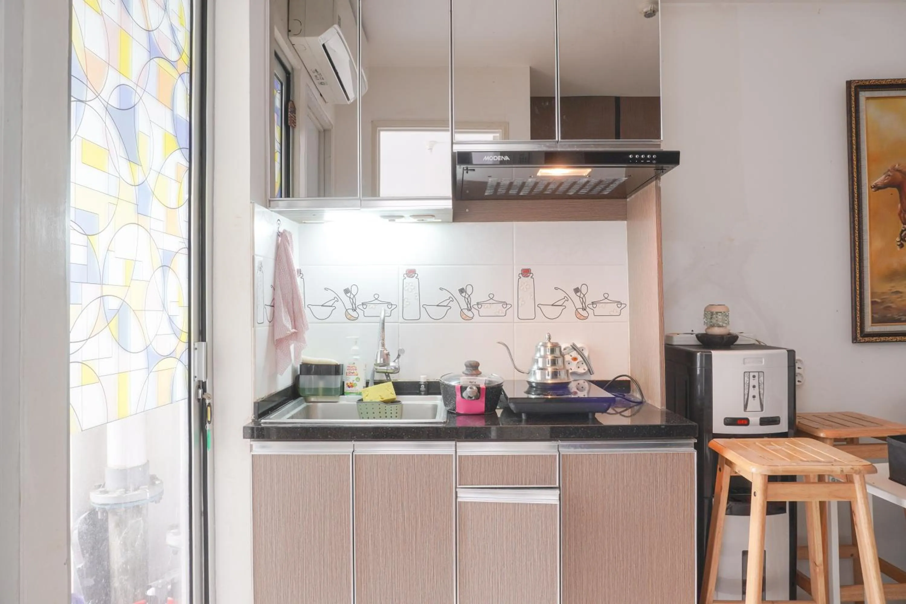 Kitchen or kitchenette in Best Startegic 2BR at Bassura Apartment By Travelio