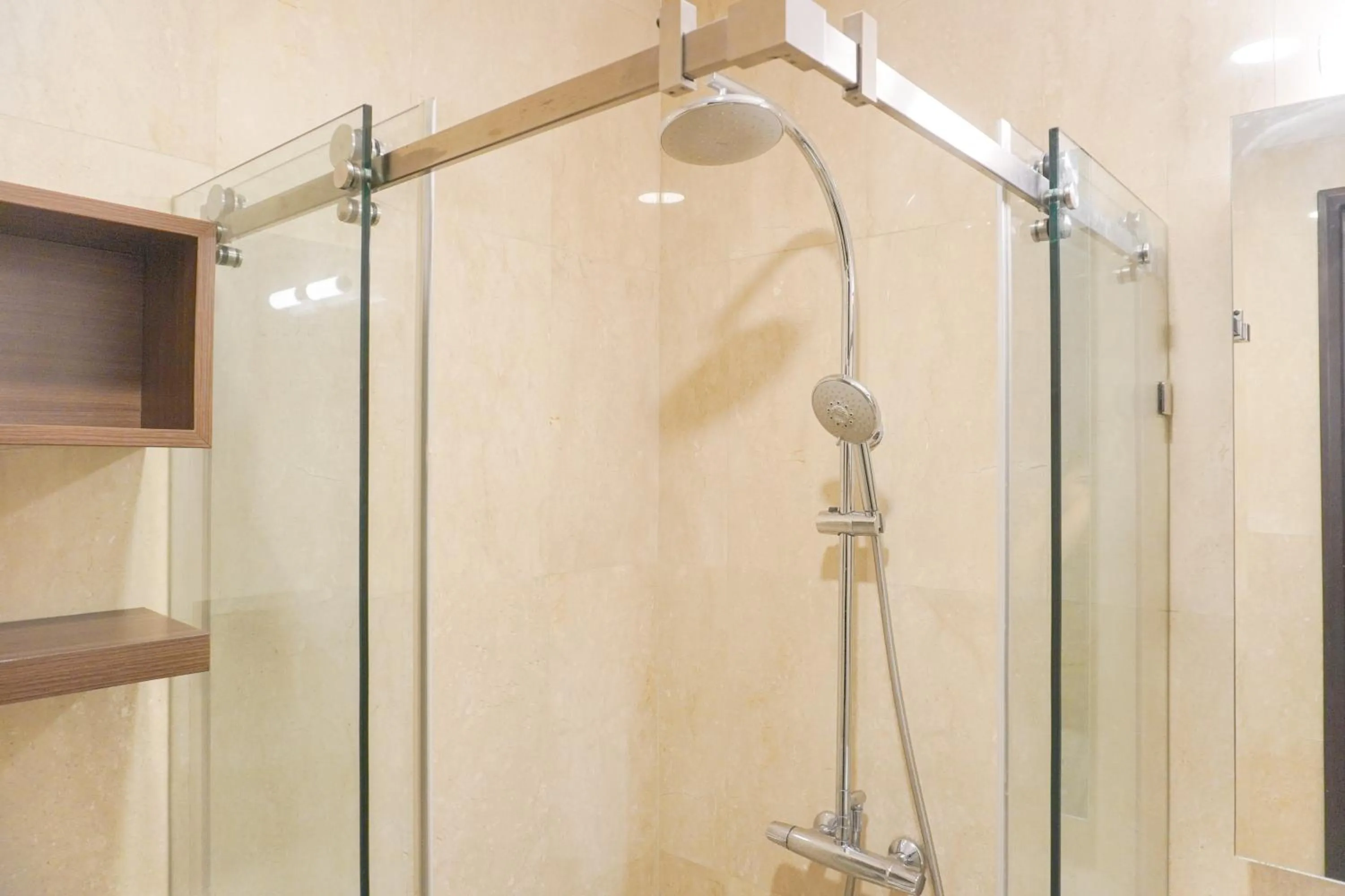 Bathroom in Comfort and Elegant 2BR Sudirman Suites Apartment By Travelio