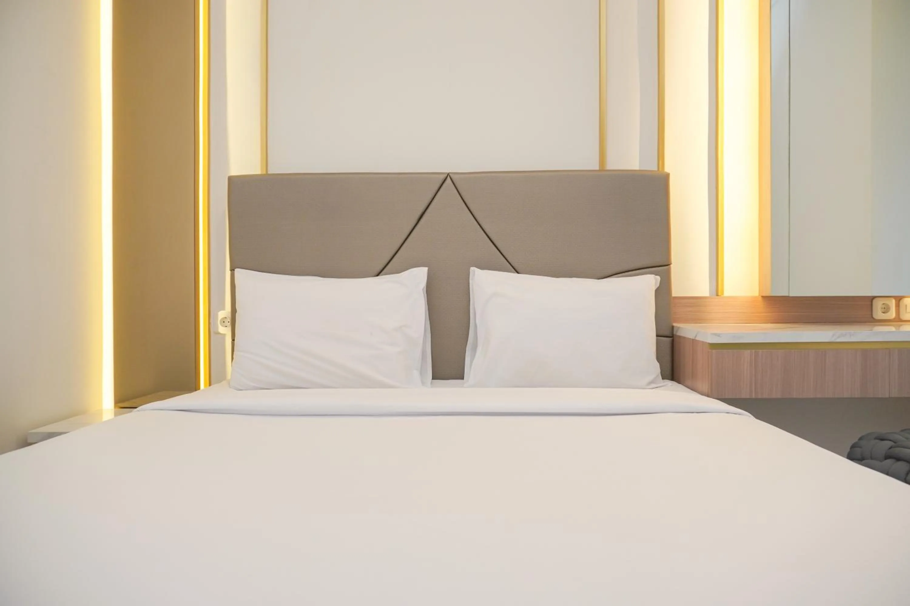 Bed in Comfort and Elegant 2BR Sudirman Suites Apartment By Travelio