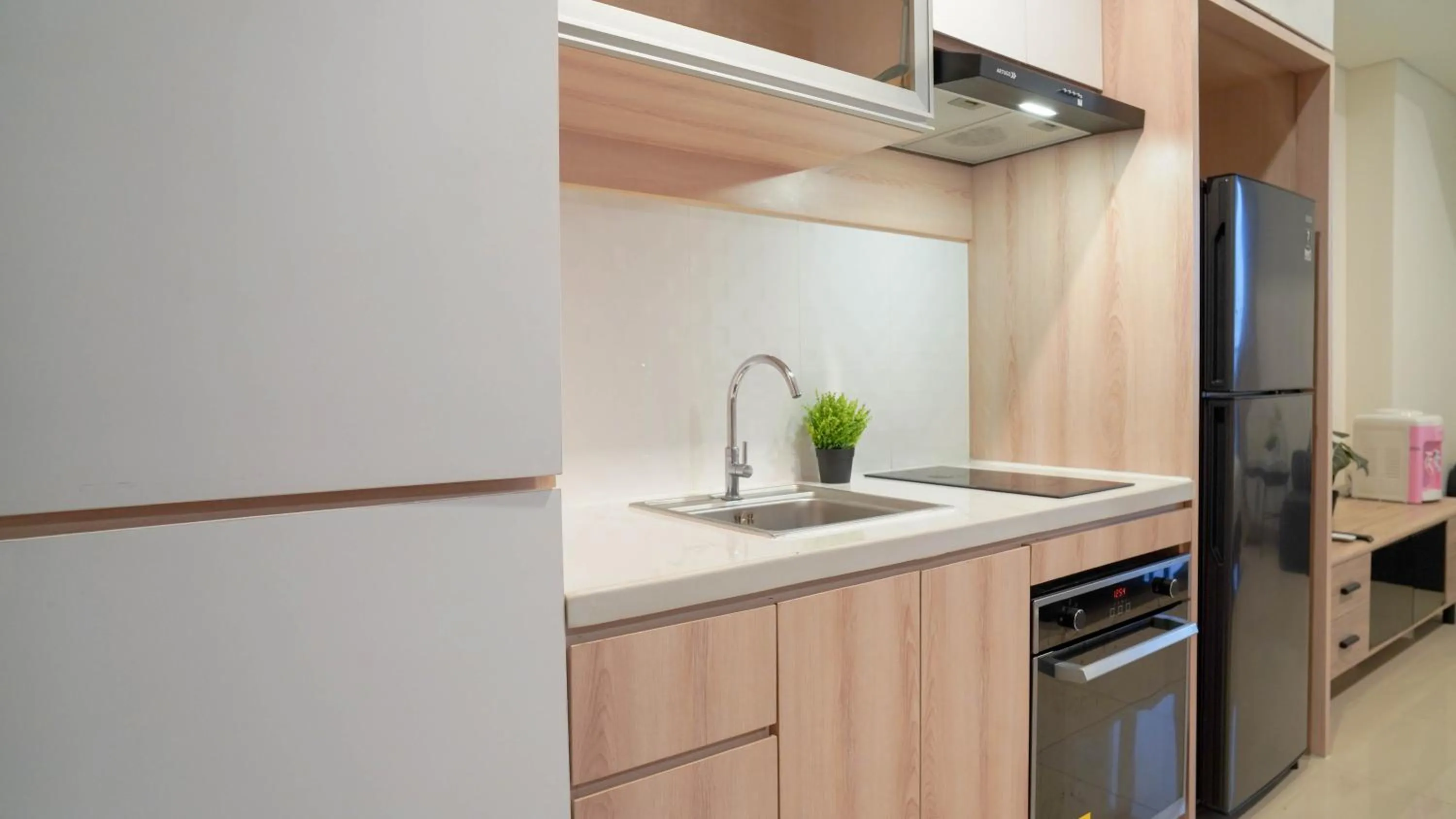 Spacious and Homey Studio at Cleon Park Apartment By Travelio