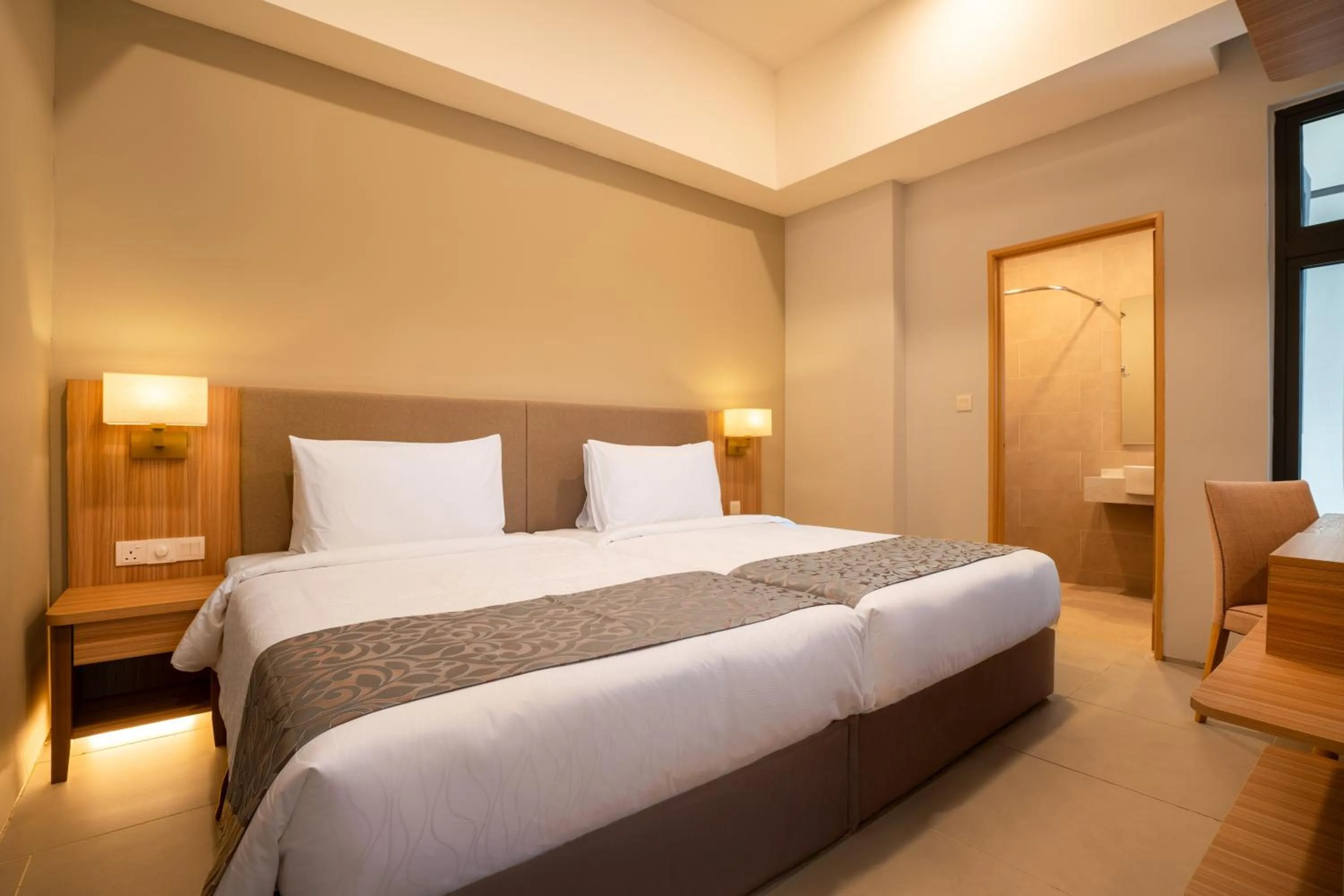 Bed in Zenith Suites Cameron