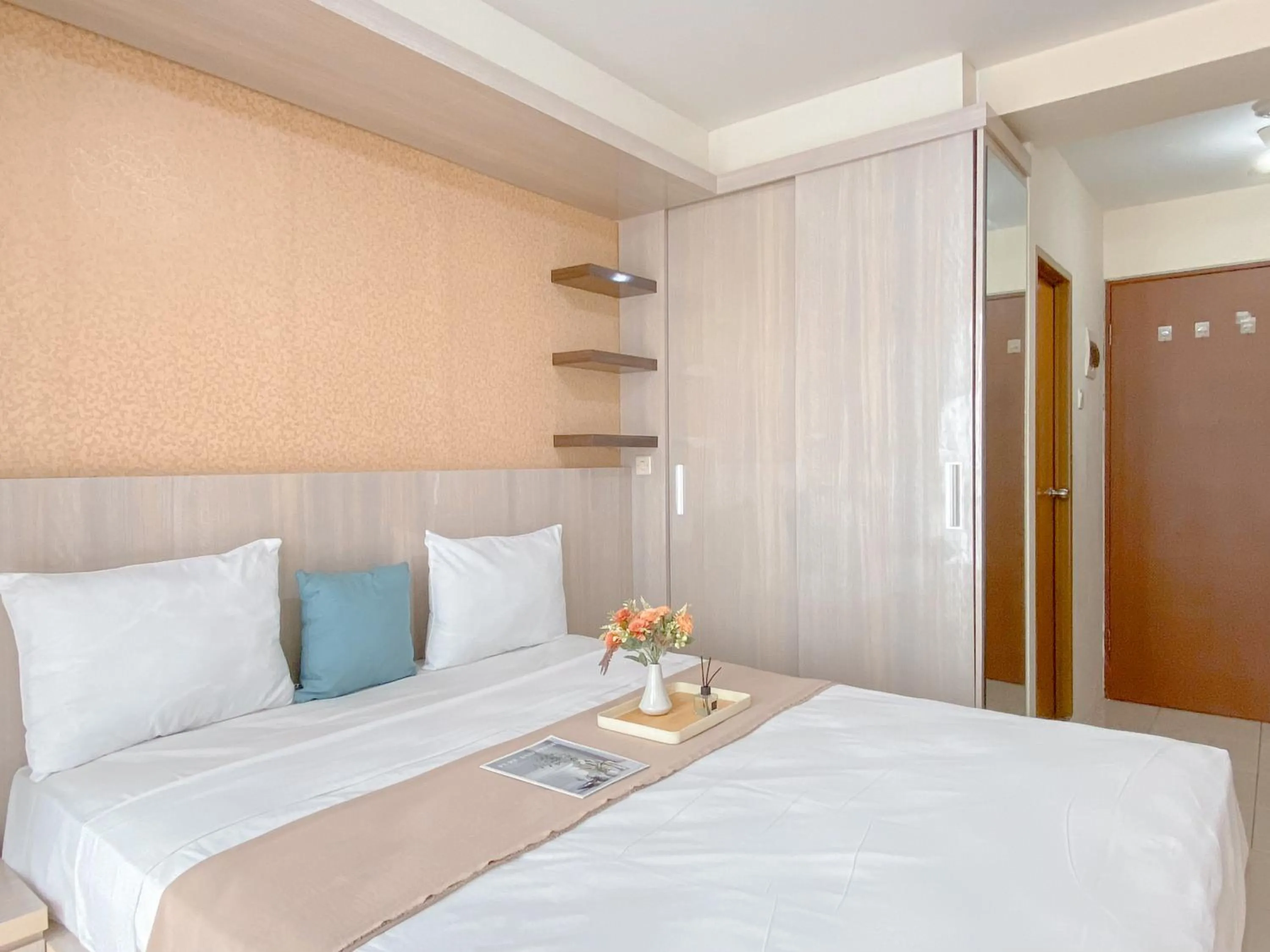 Bed in Modern Look and Comfy Studio Tifolia Apartment By Travelio