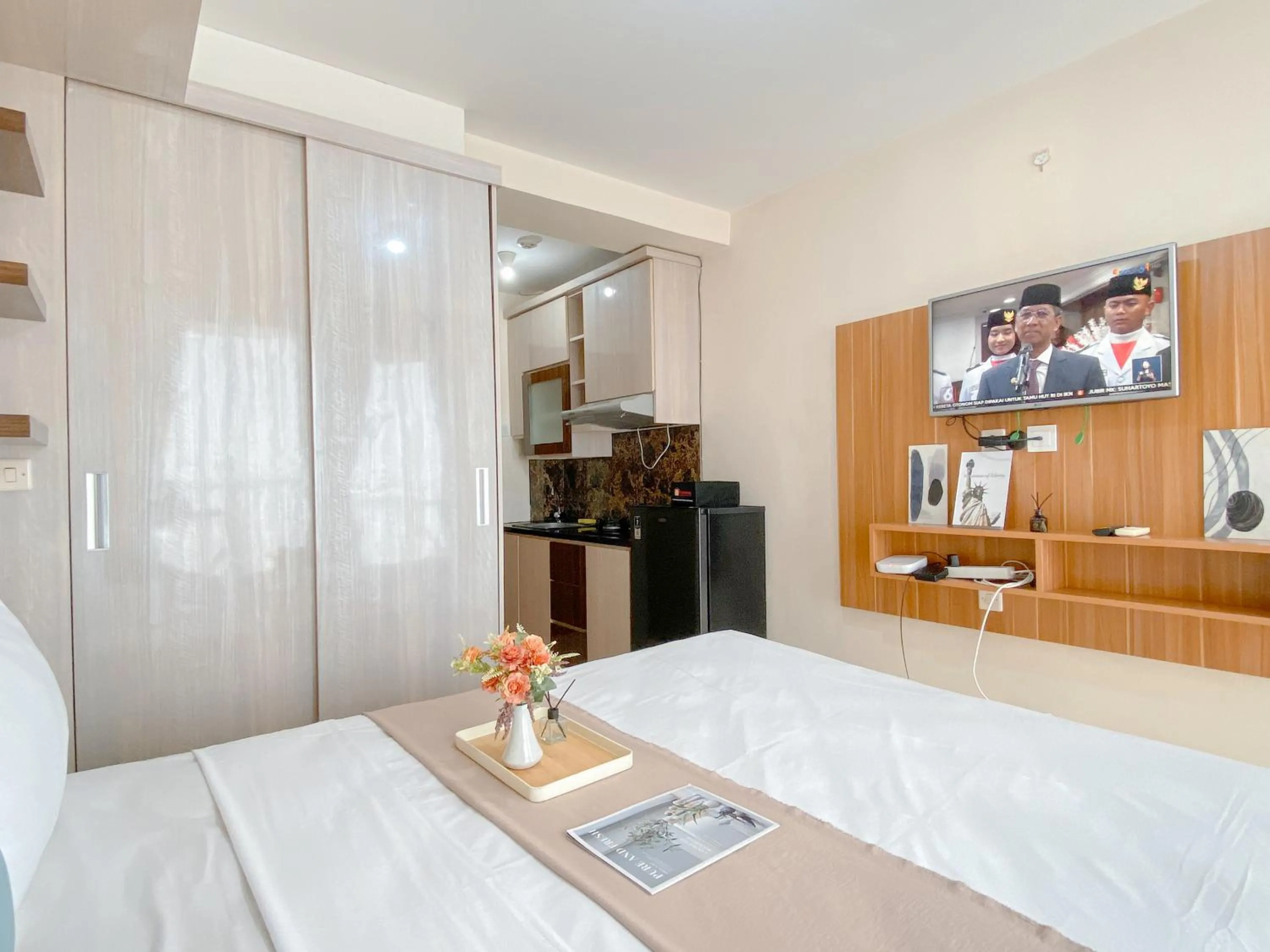 Bed in Modern Look and Comfy Studio Tifolia Apartment By Travelio