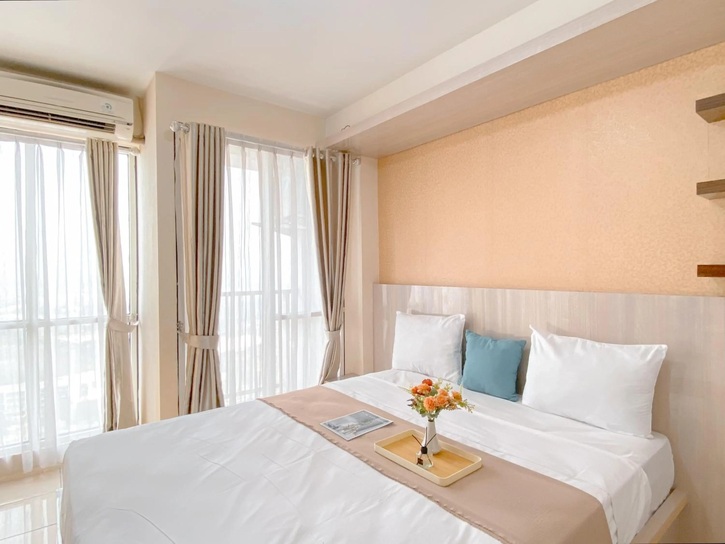 Bed in Modern Look and Comfy Studio Tifolia Apartment By Travelio