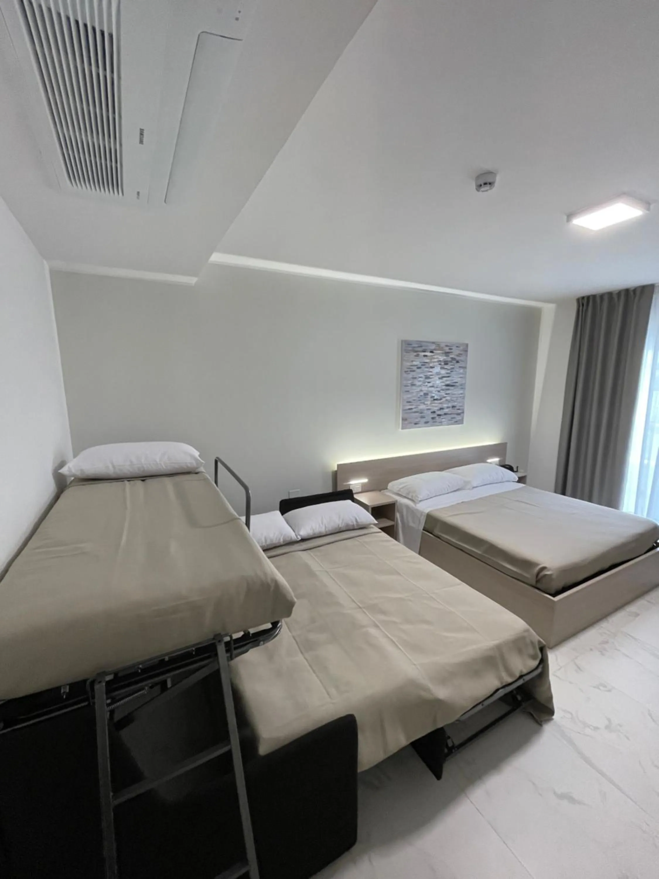 Bed in Hotel Diadema