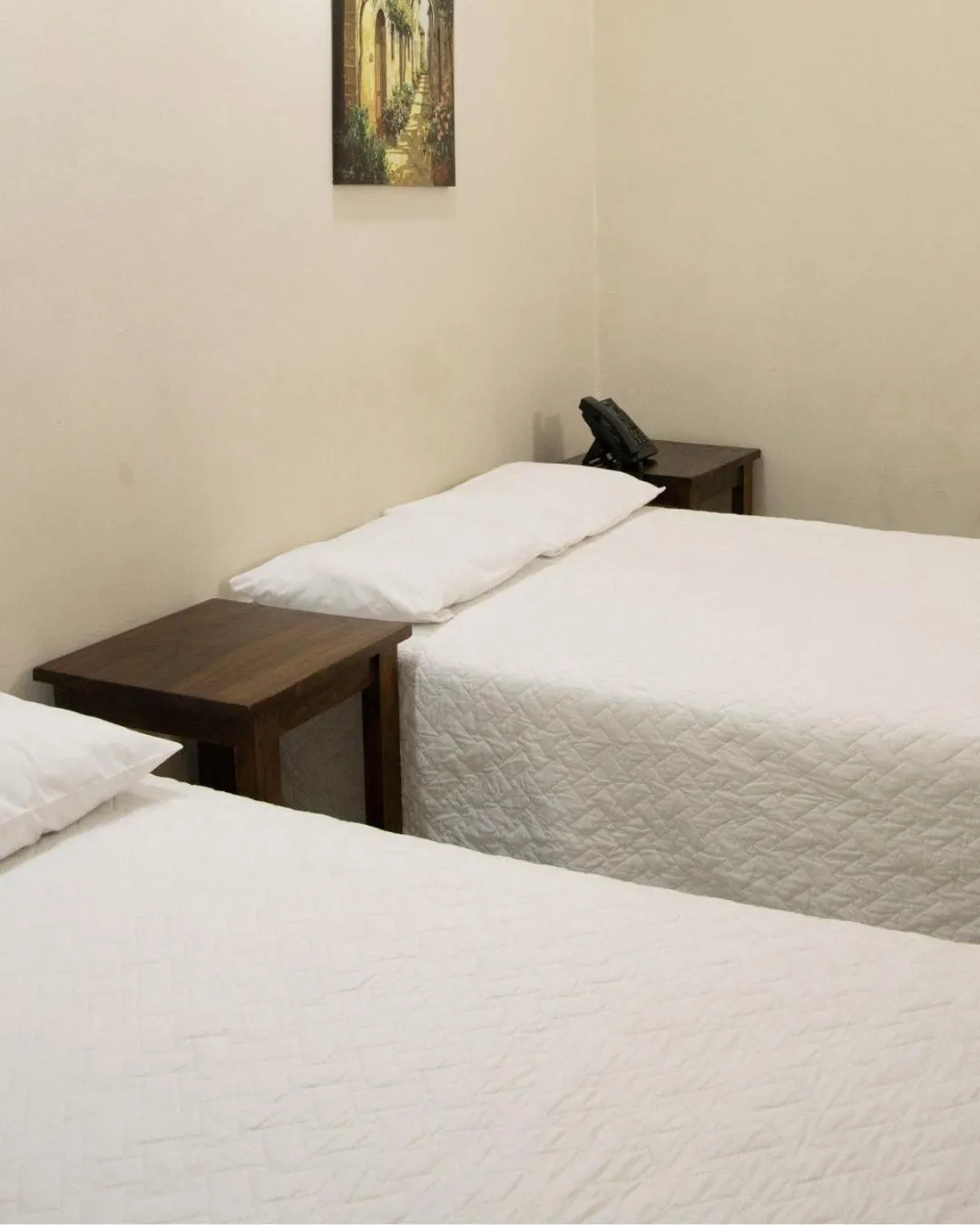 Bed in Lorenzo Hotel