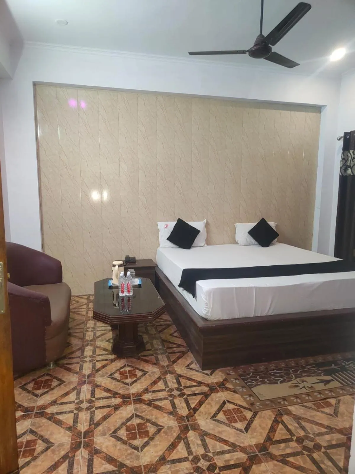 Seating area, Bed in Mansarover Hotel & Banquets