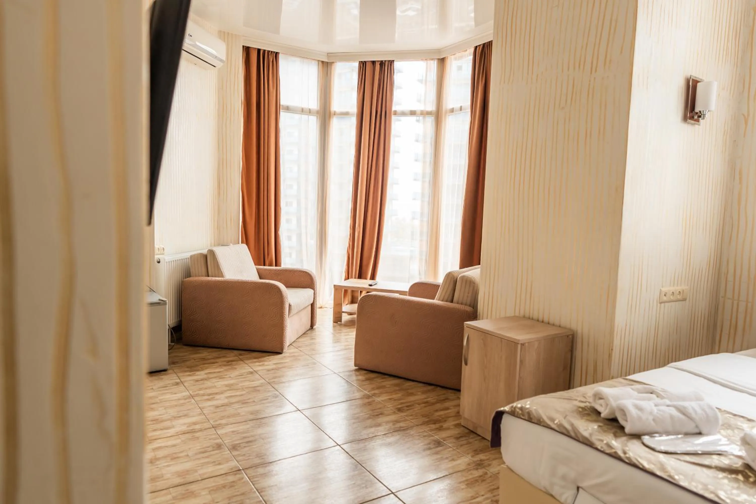 Seating area, Bed in Batumi Inn Hotel