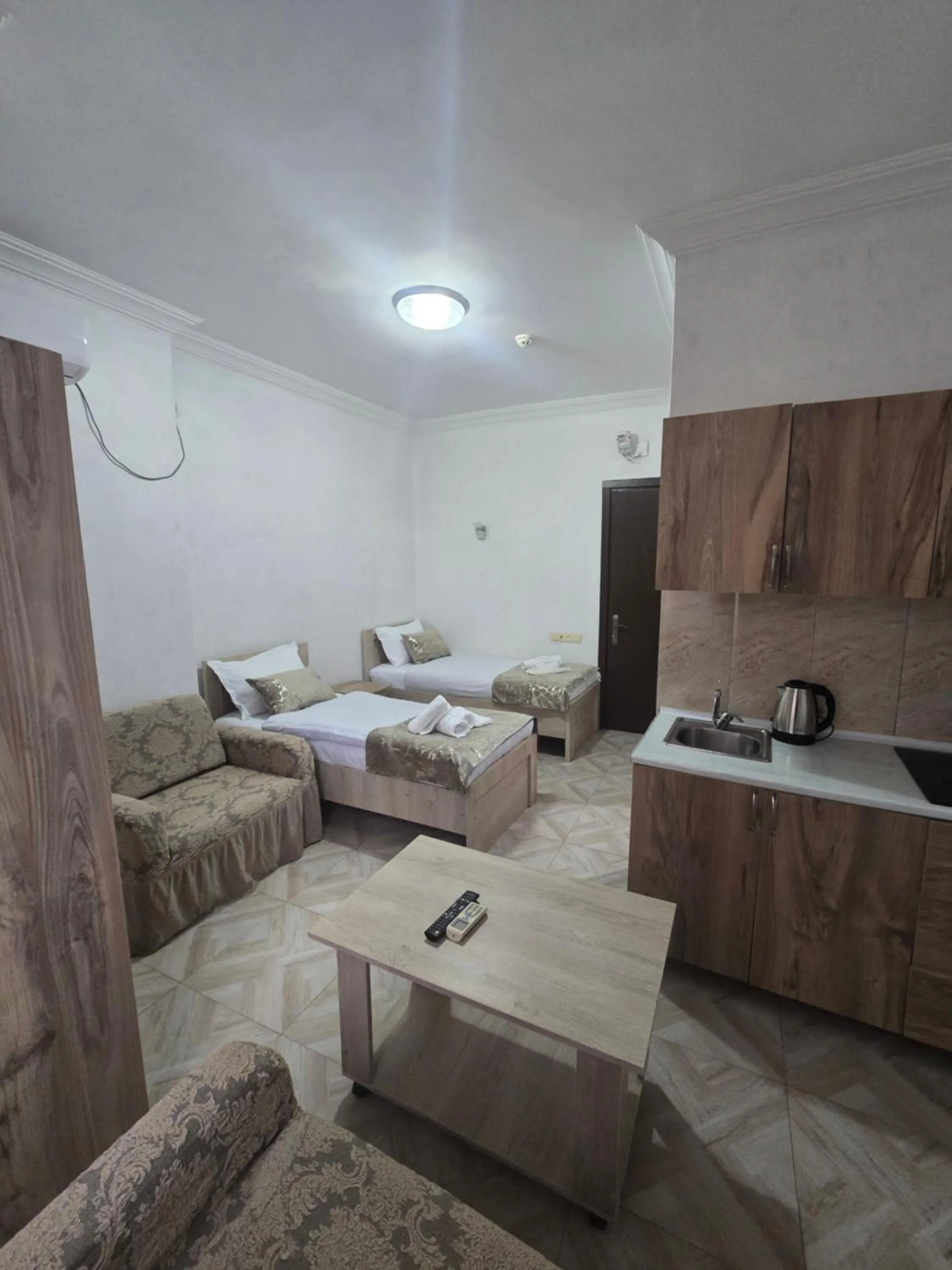 Kitchen or kitchenette, Bed in Batumi Inn Hotel