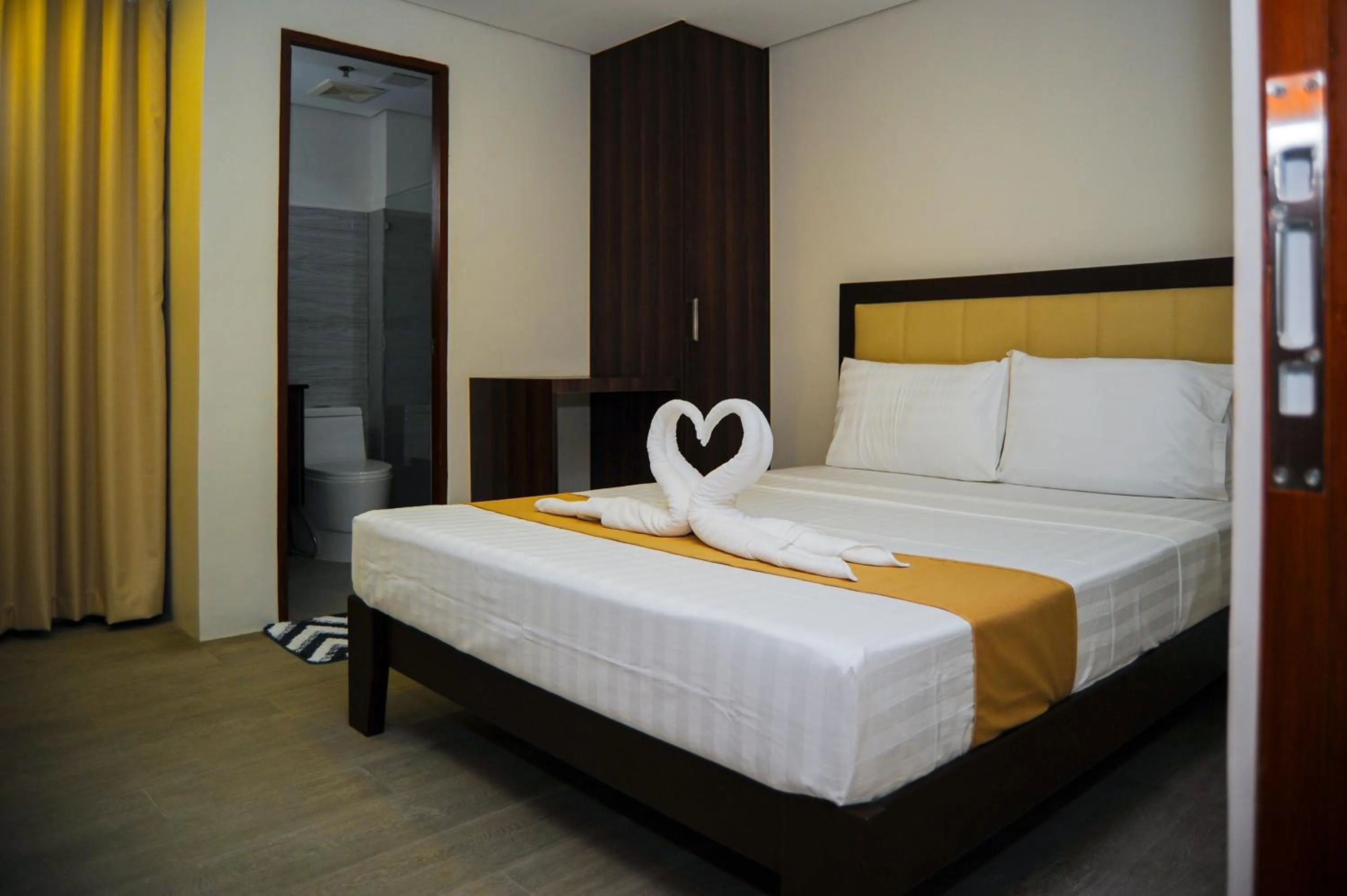 Bed in Kaia Isabelle Hotel Puerto Princesa