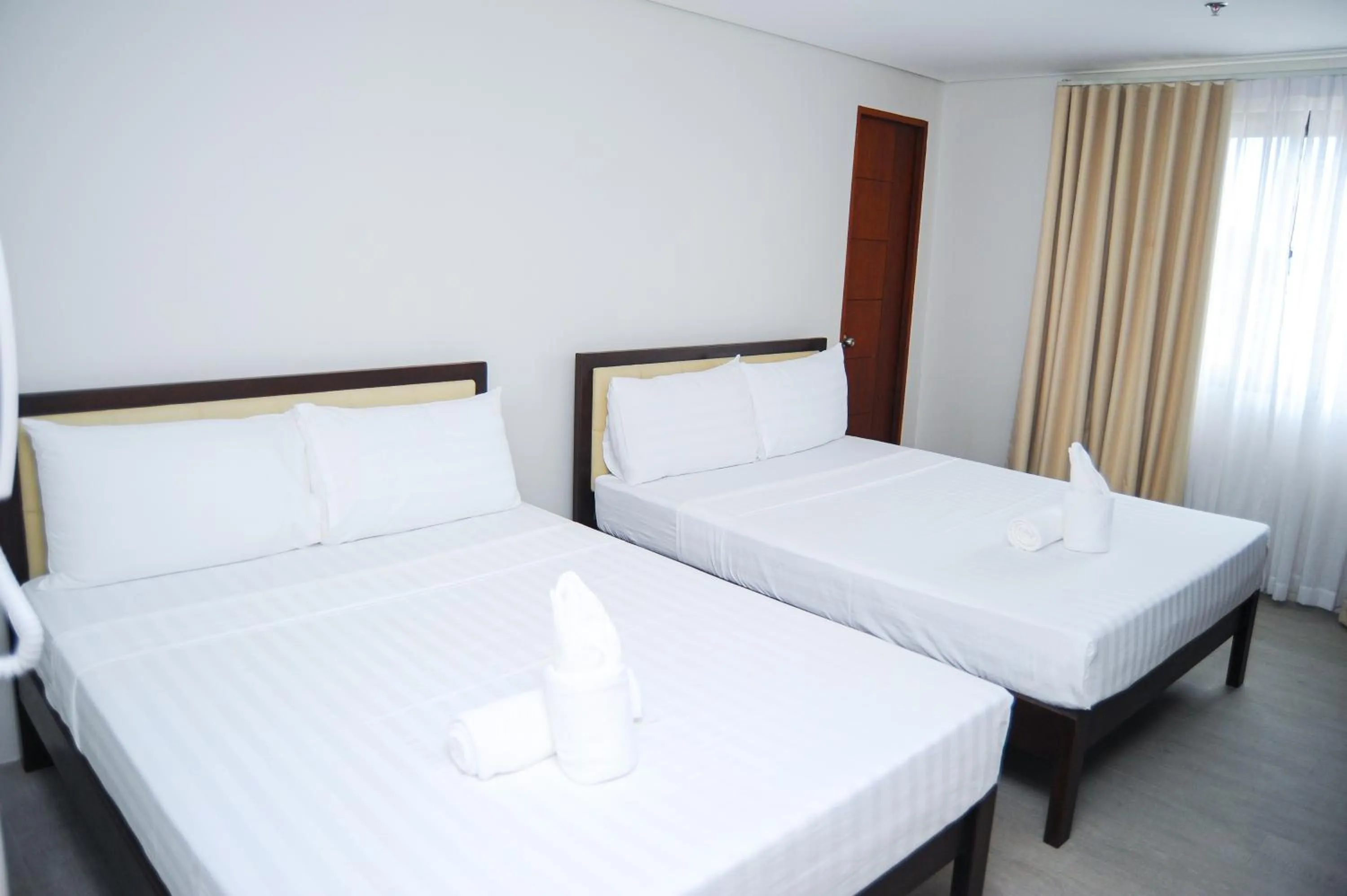 Bed in Kaia Isabelle Hotel Puerto Princesa