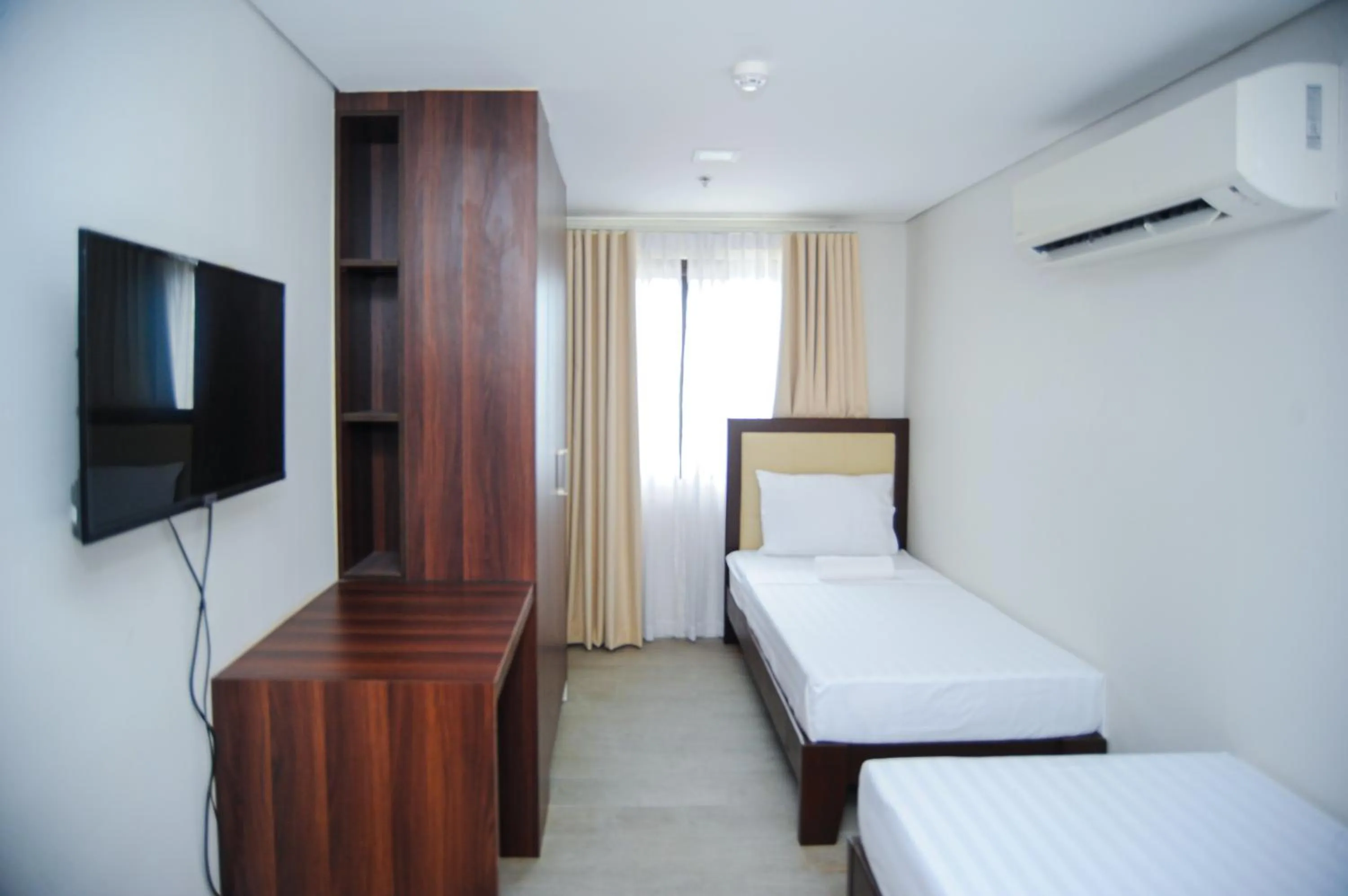 Bed in Kaia Isabelle Hotel Puerto Princesa