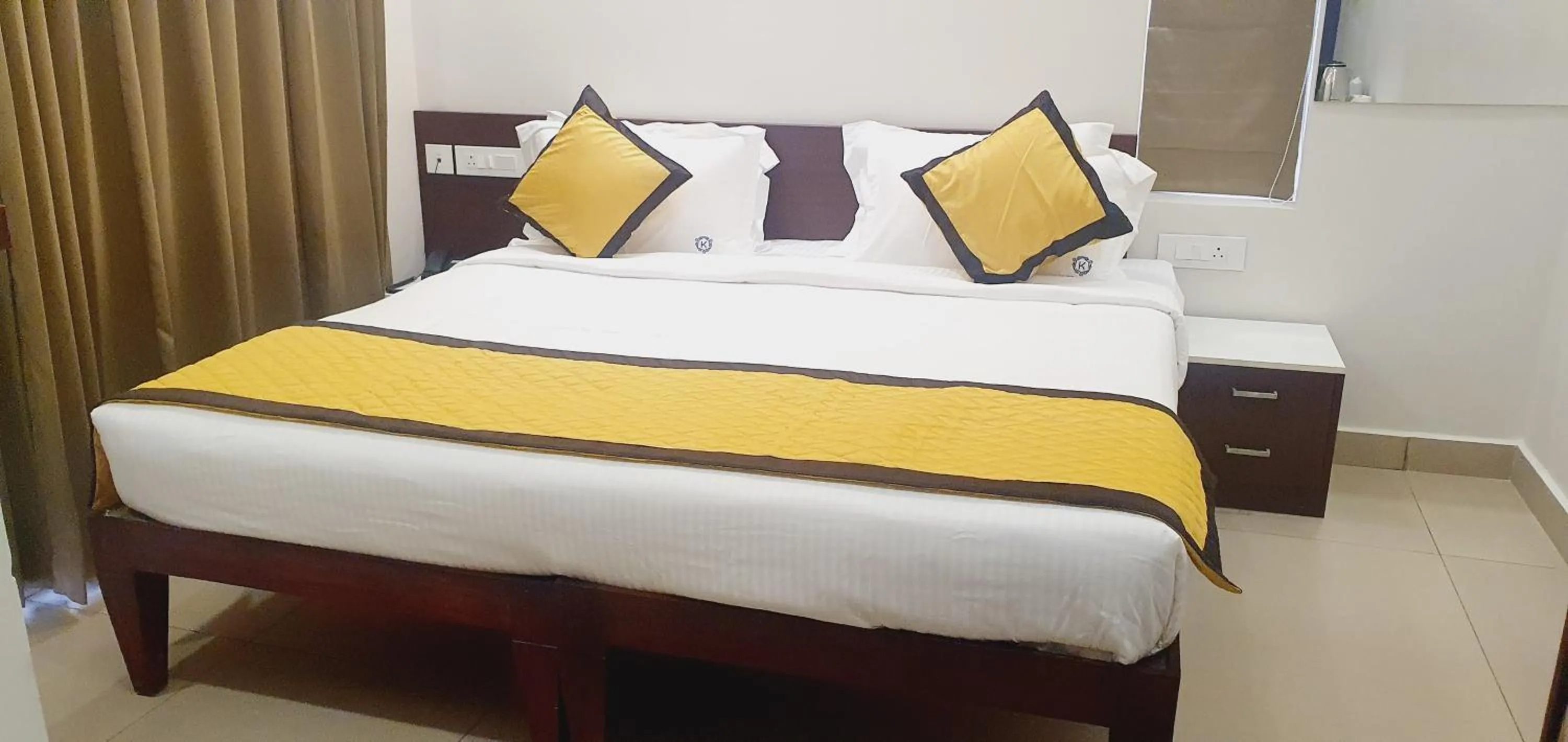 Bed in K Grandeur Hotels