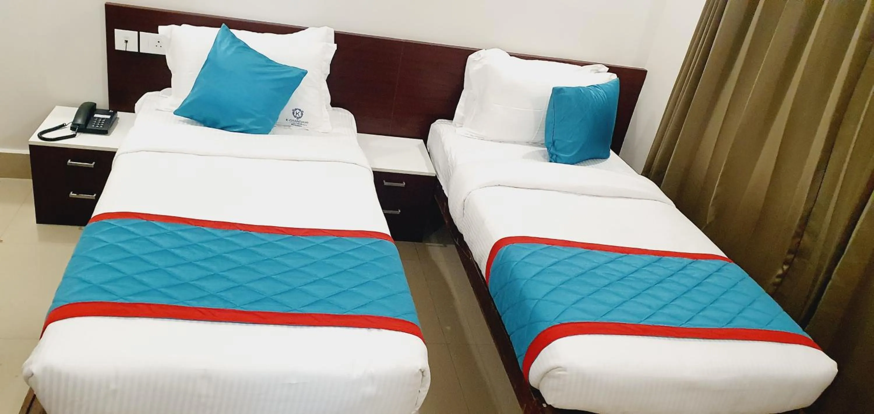 Bed in K Grandeur Hotels