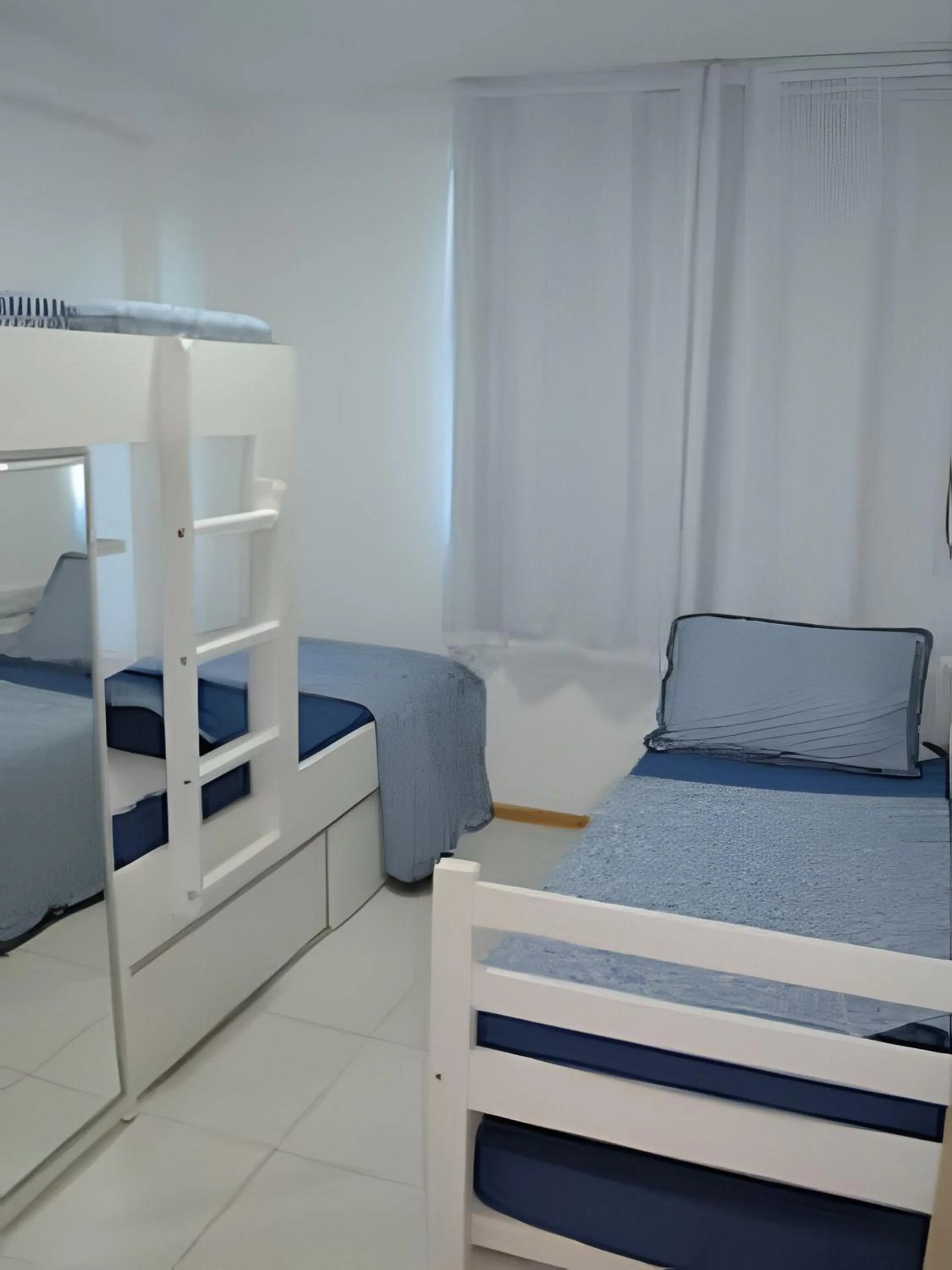 Bed in Nui Supreme Beach Living