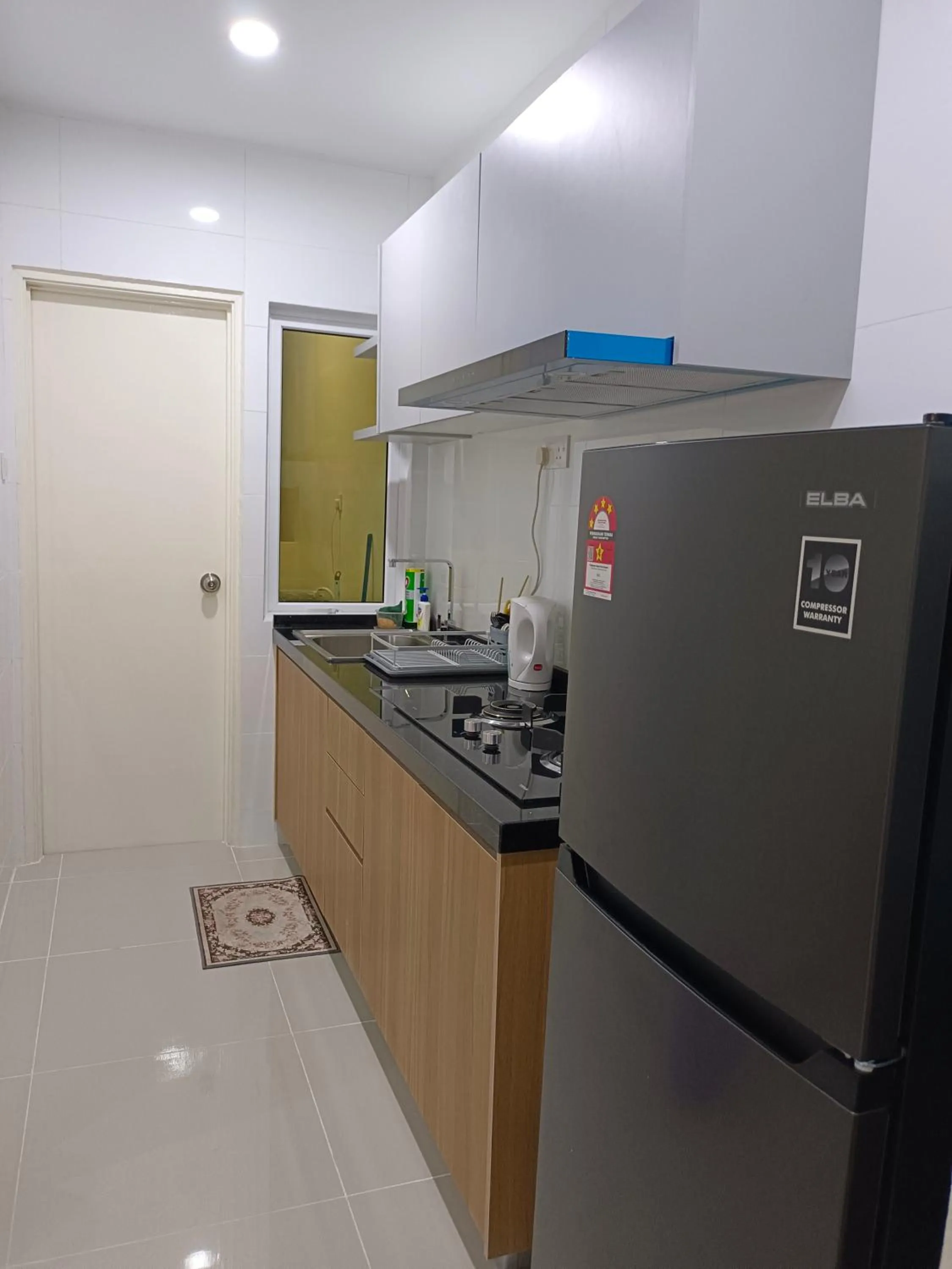 Kitchen or kitchenette in Sri Indah Pool Condostay
