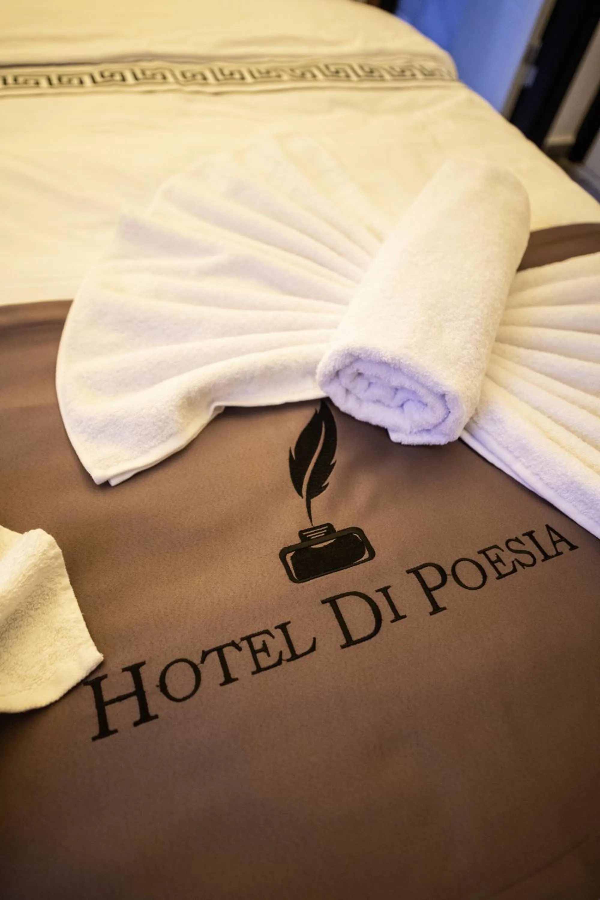 Property logo or sign in hotel di poesia deluxe