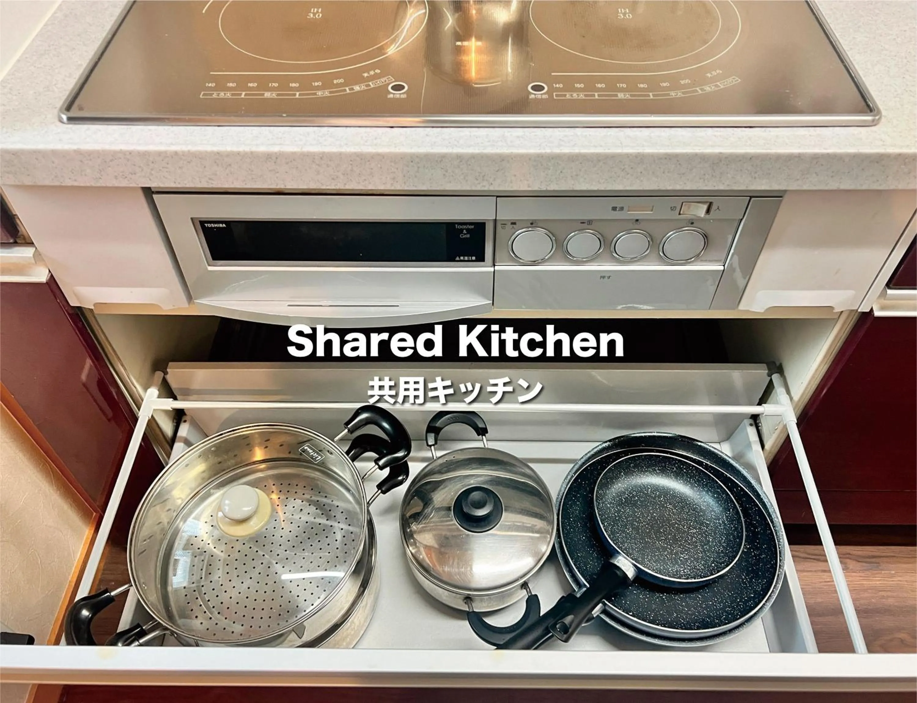 Communal kitchen in Jinya Sunset Inn by Murasaki