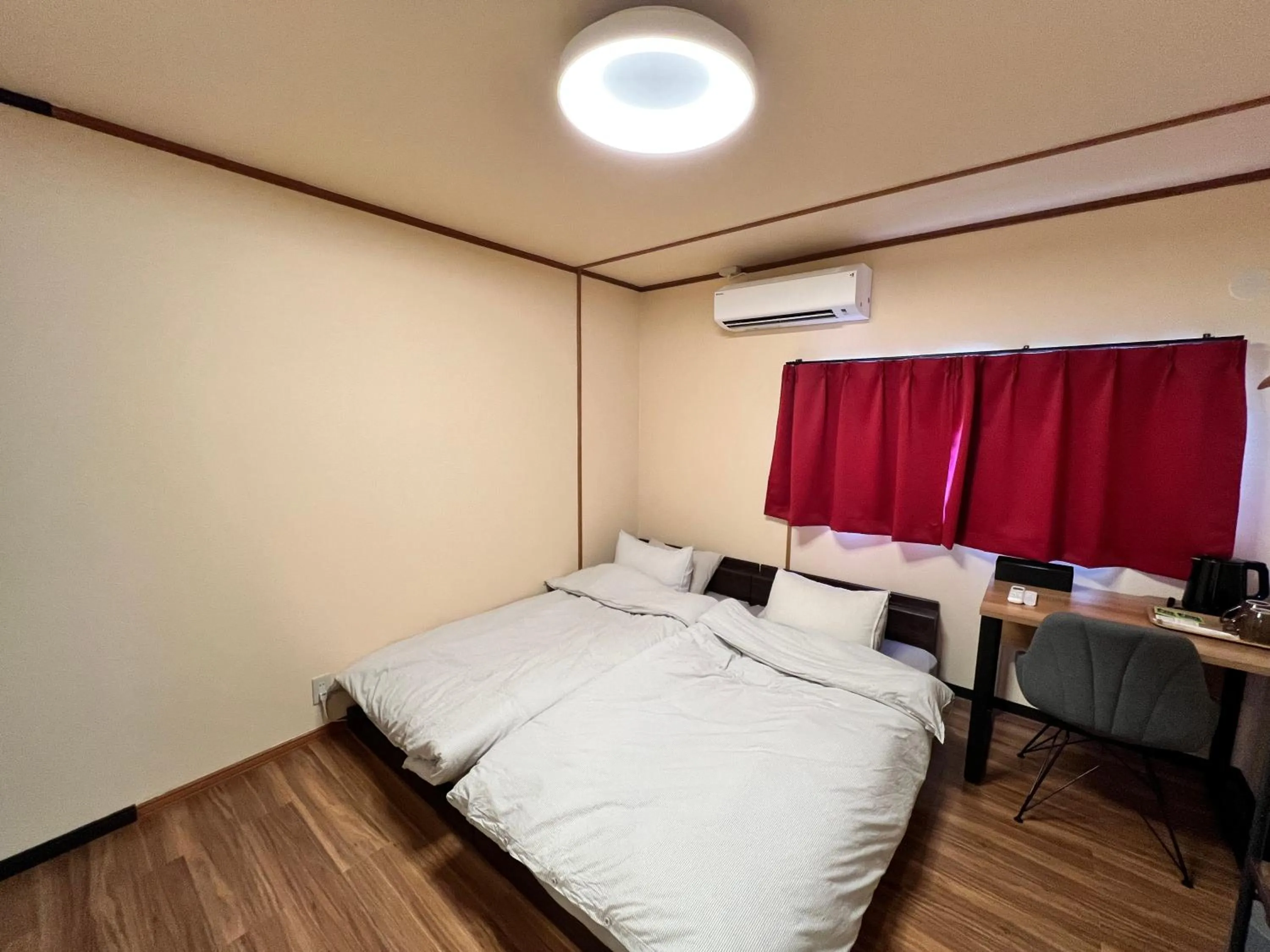 Bed in Jinya Sunset Inn by Murasaki