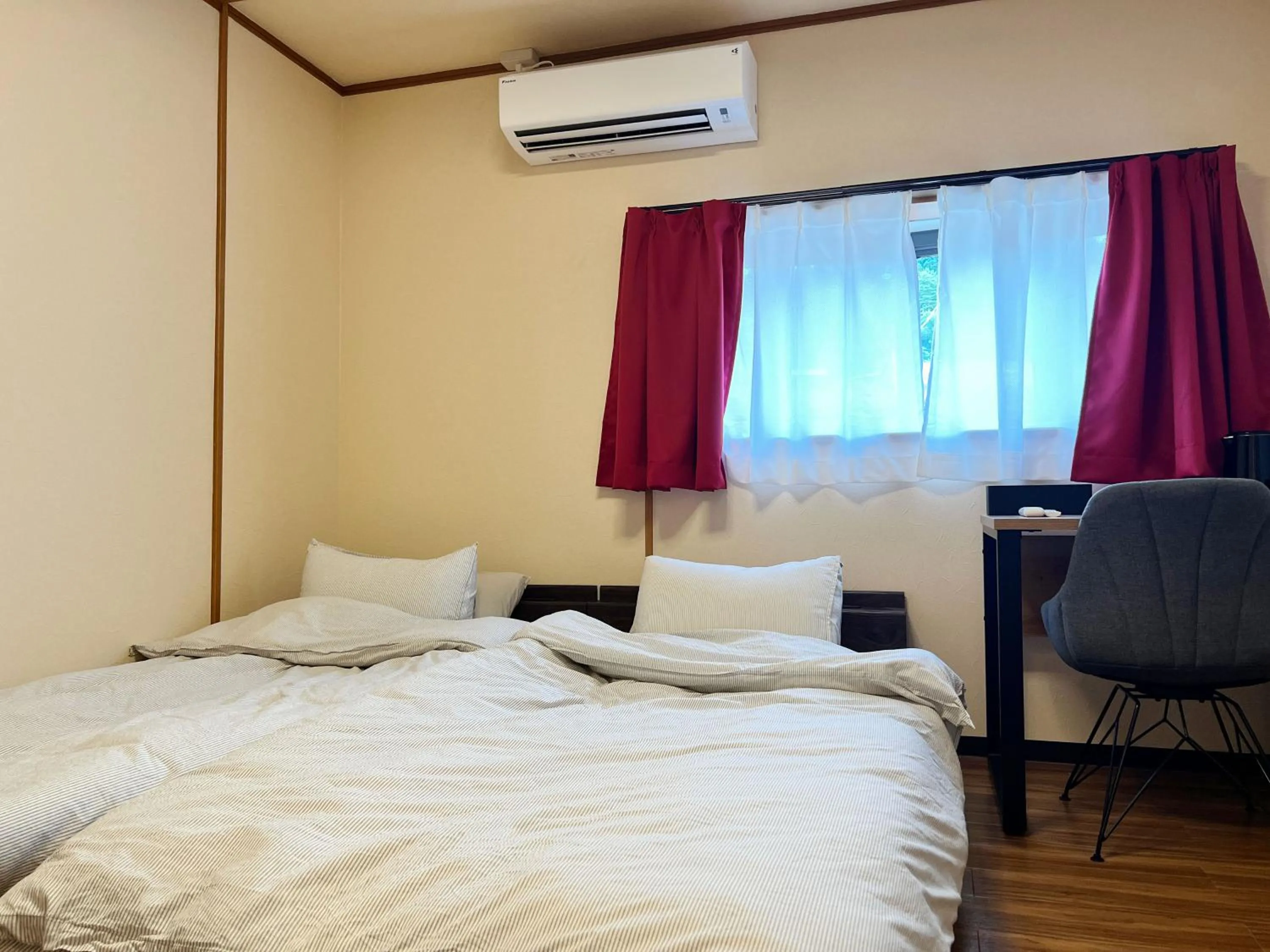 Bed in Jinya Sunset Inn by Murasaki